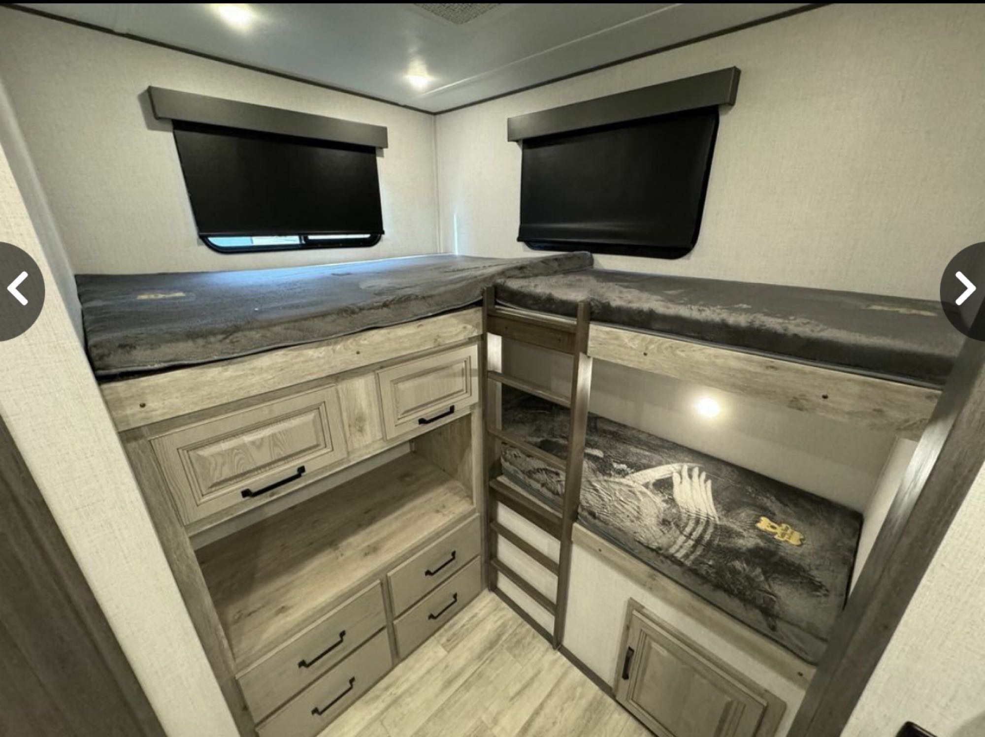 Spacious RV rental bunk beds with a ladder & built-in storage, designed for comfortable family adventures.. Keystone Alpine Avalanche 2024
