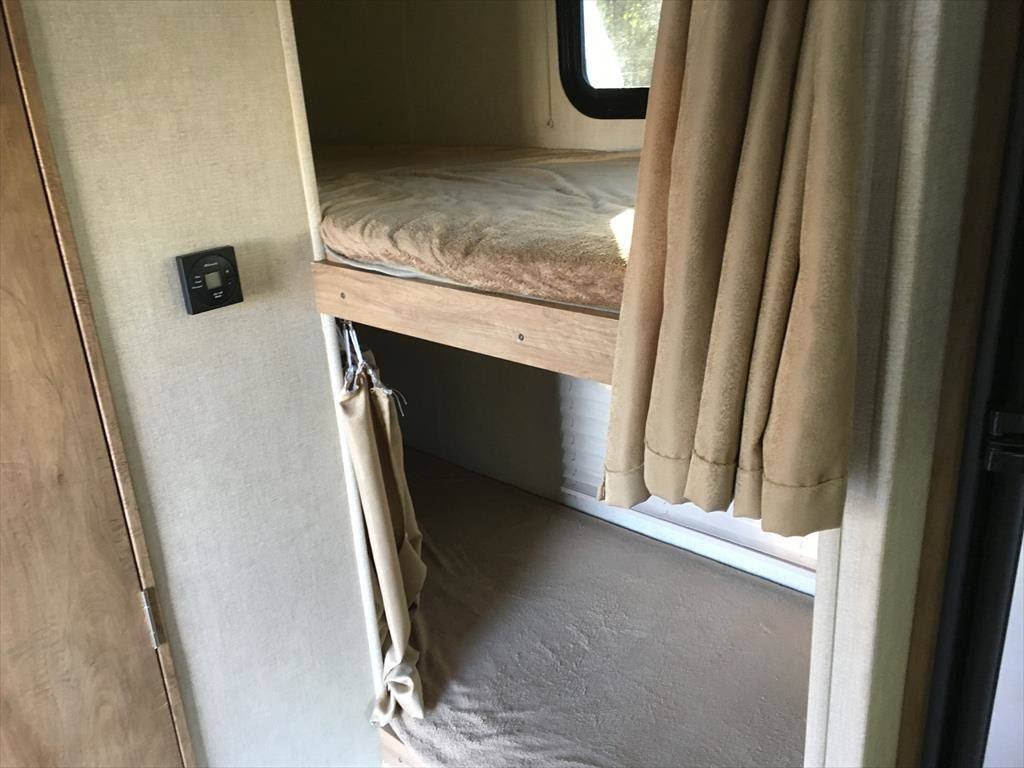 Double bunk bed. 6 ft in length. Window and light with each bunk. Gulf Stream Conquest 2017