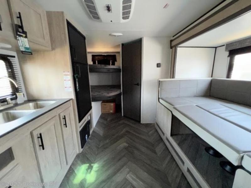 Spacious RV rental interior with kitchen, bunk beds, and a comfortable convertible dinette.. Heartland RVs Prowler Lynx 2022