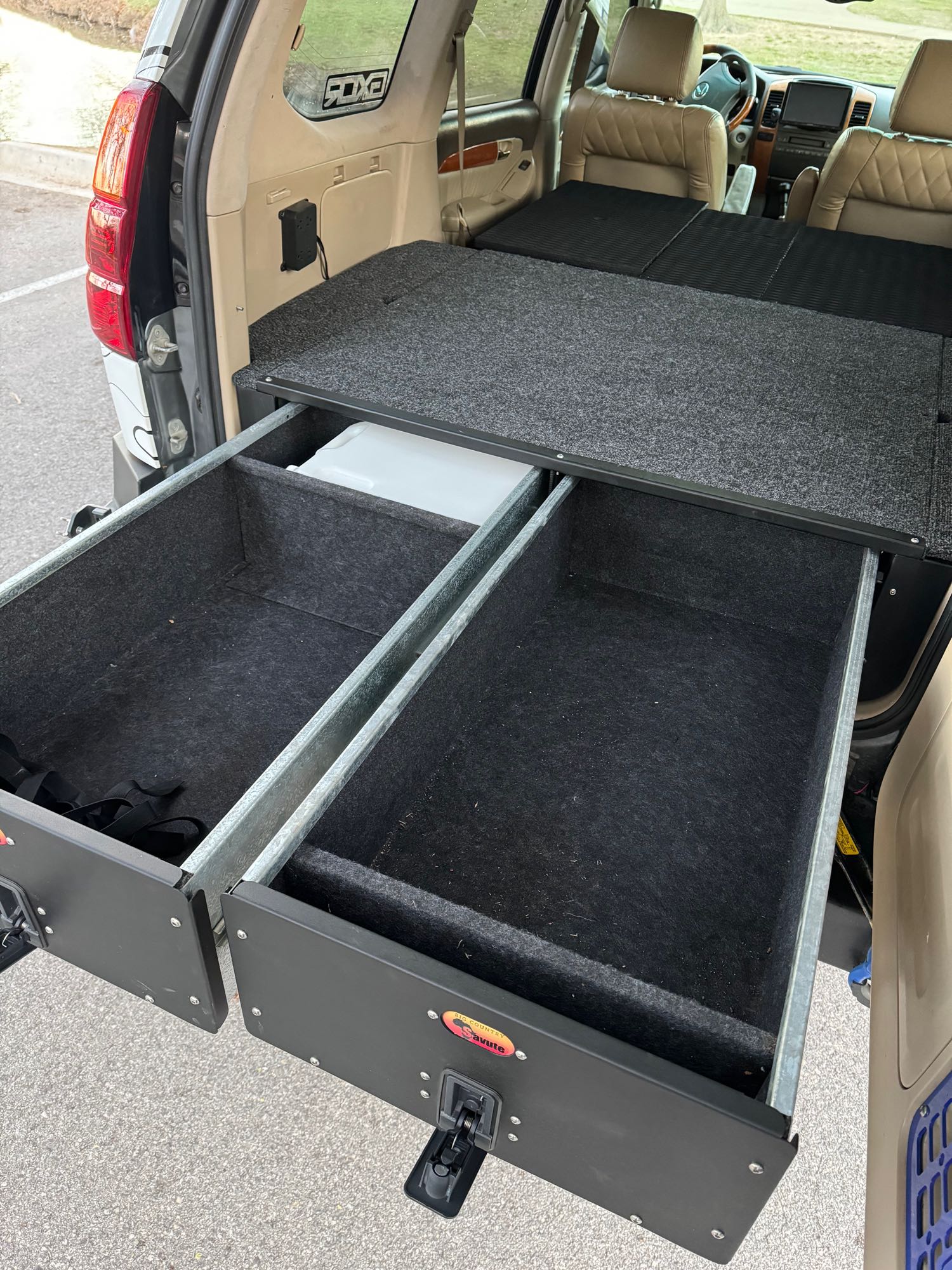 Custom SUV cargo drawers offer organized storage. Perfect for an rv rental, camping, or overlanding adventures.. Lexus GX470 2003