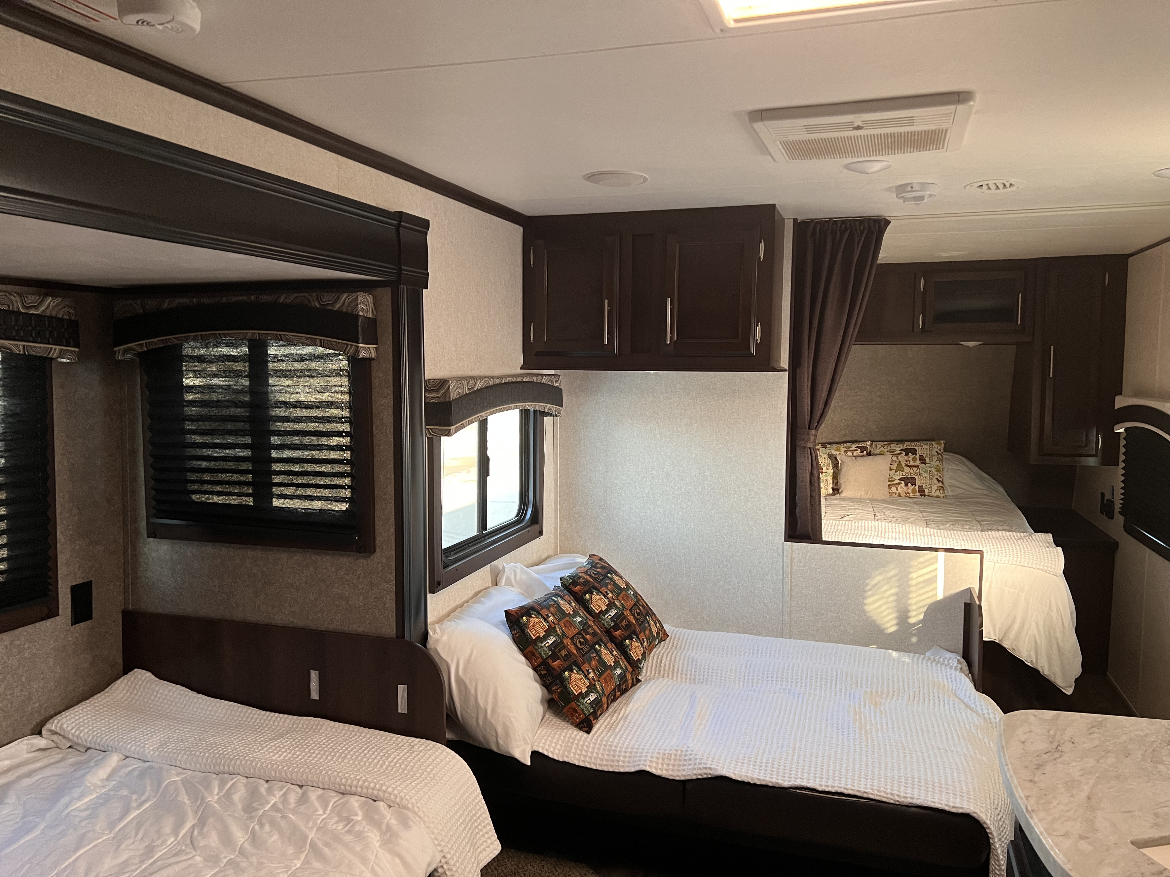 RV rental interior, a travel trailer with multiple sleeping areas and comfortable beds for travel adventures.. Jayco Jay Flight 2019