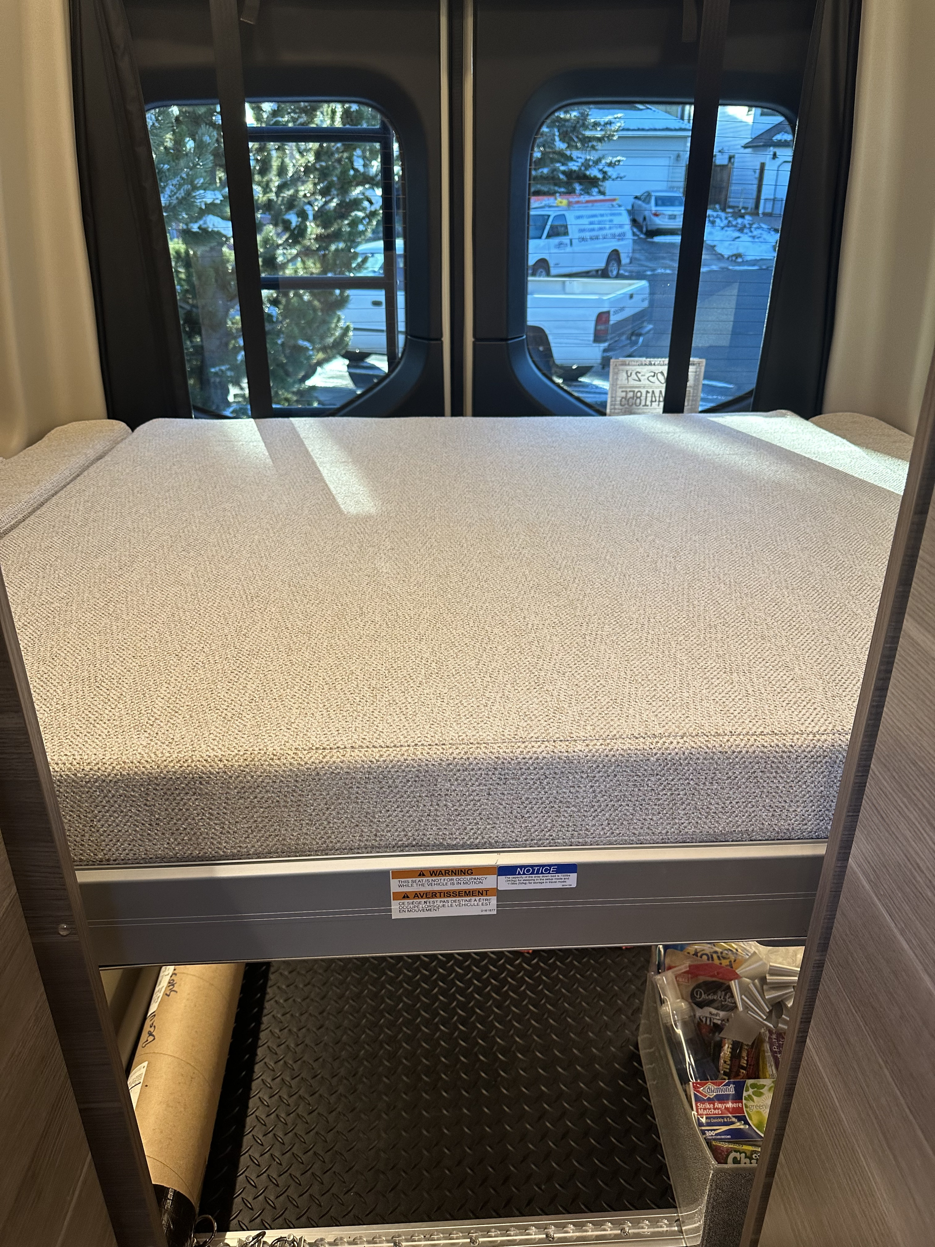 RV rental interior features a cozy bunk bed with under-bed storage, including a diamond plate floor for gear.. Mercedes-Benz Entegra Launch 2024