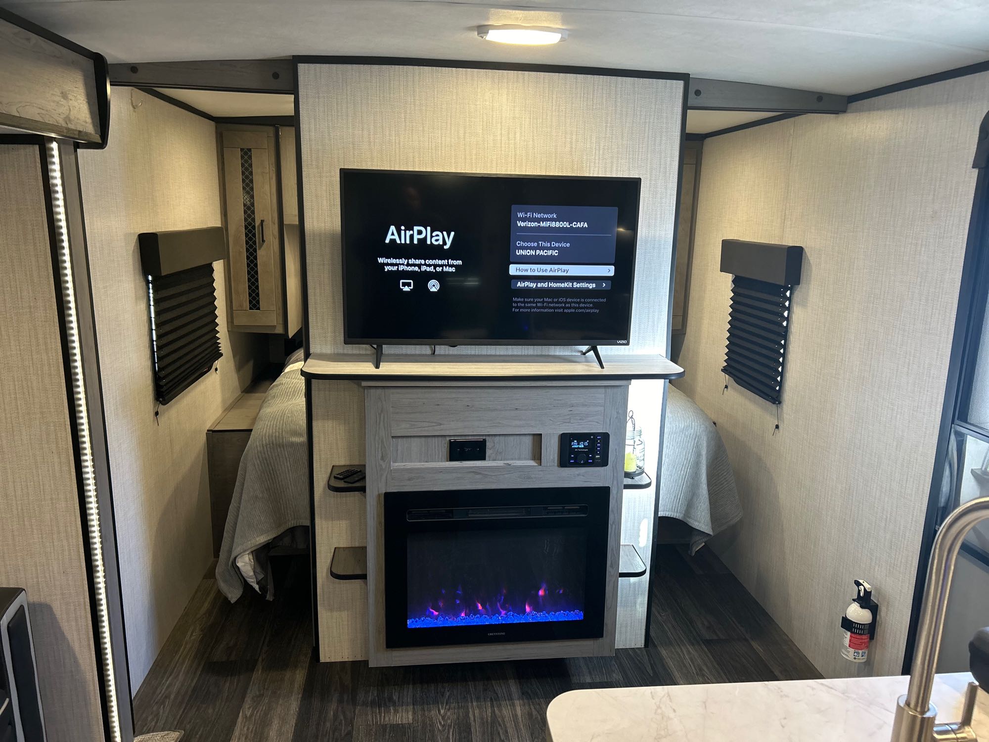 Modern rv rental features a Vizio smart TV with AirPlay, an electric fireplace, and beds on both sides for comfort.. Heartland RVs Mallard 2021
