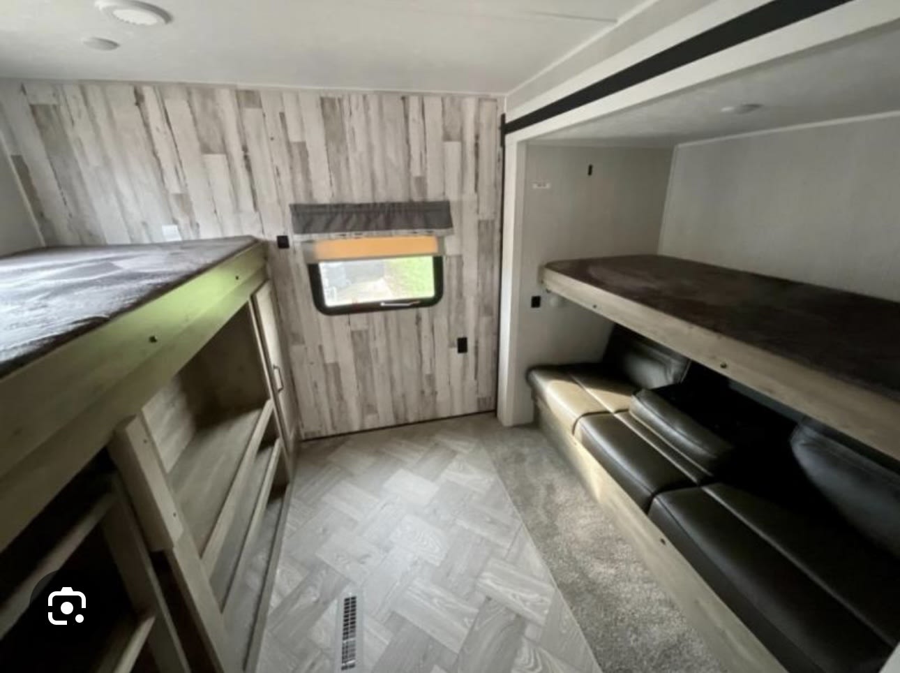 This RV rental's spacious interior features comfortable bunk beds, a convertible sofa, and stylish wood paneling for your trips.. Forest River Palomino Puma 2022
