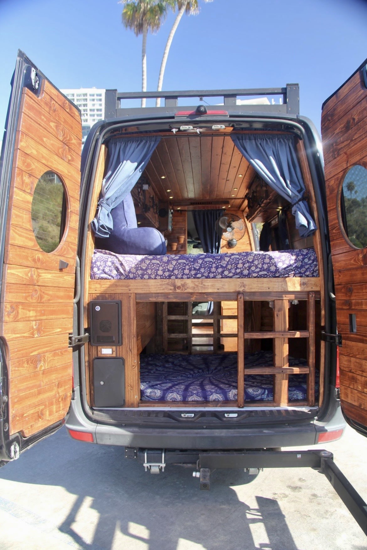 This RV rental offers a custom wood interior with bunk beds, perfect for a cozy van conversion adventure.. Mercedes-Benz Sprinter 2016