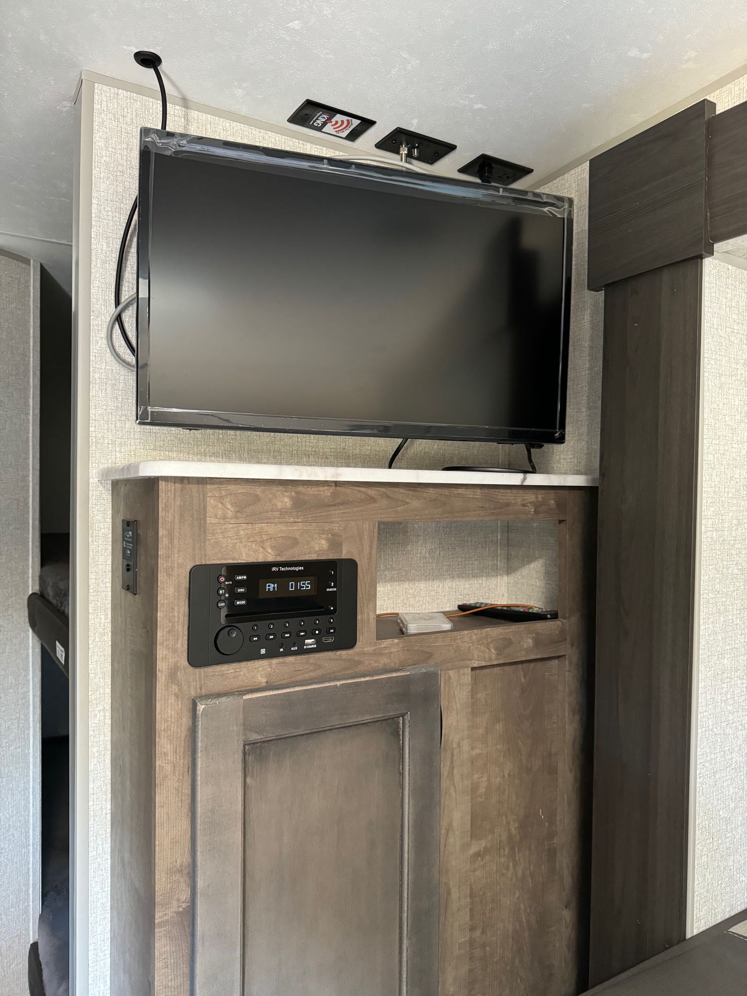 This RV rental features a built-in entertainment center: a flat-screen TV above an IRV Technologies stereo and storage cabinets.. Sonic Sonic Trailer 2022