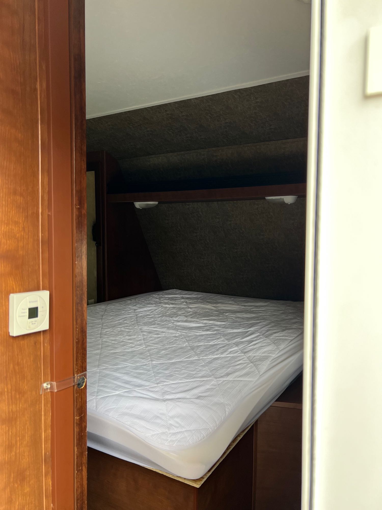 Queen bed/bedroom with door, closets storage and mirrors. . Aspen Trail Aspen Trail Trailer 2014