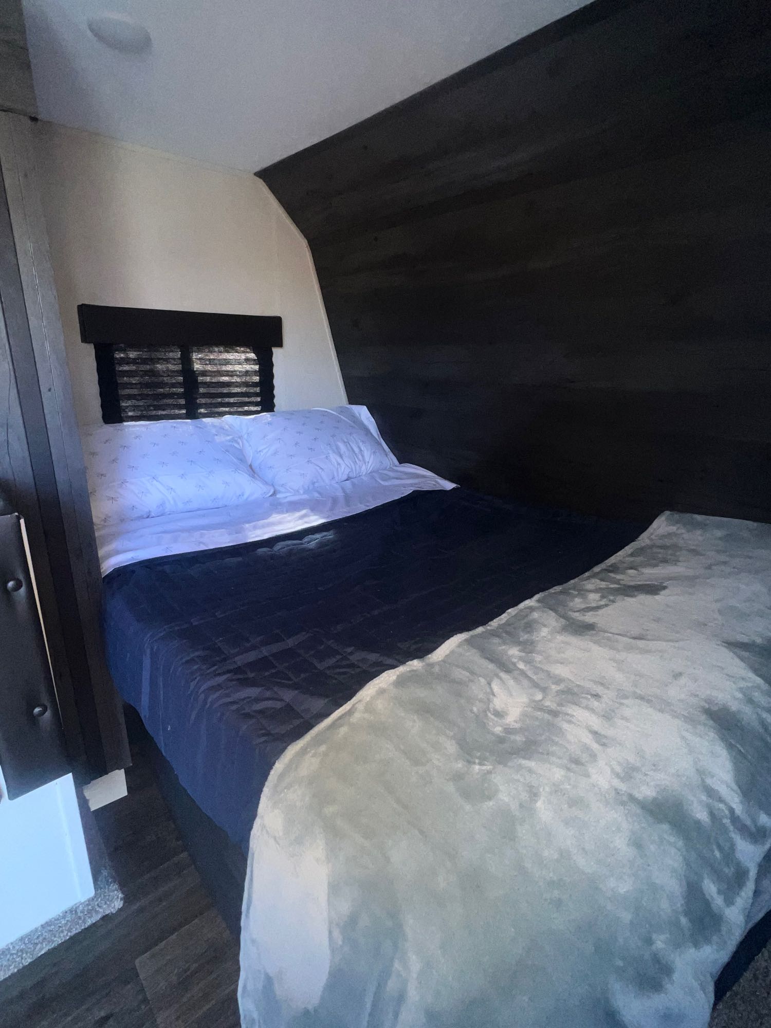 Cozy RV rental bedroom featuring a comfy bed and modern decor, ideal for a relaxing travel experience.. Keystone RV Hideout 2021