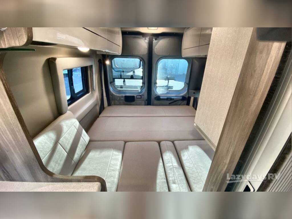 Get ready for adventure! This RV rental offers a comfortable, functional sleeping area with windows and storage in a camper van.. Thor Tellaro 2023