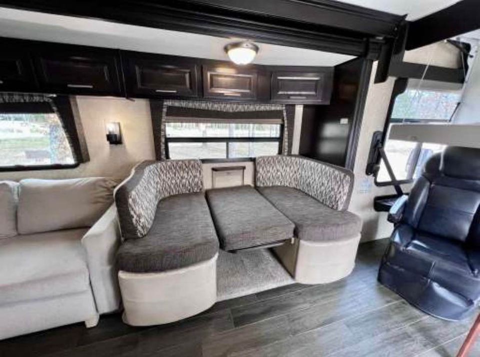 Dinette easily converts to a comfortable bed. Forest River Georgetown XL 369DS 2015