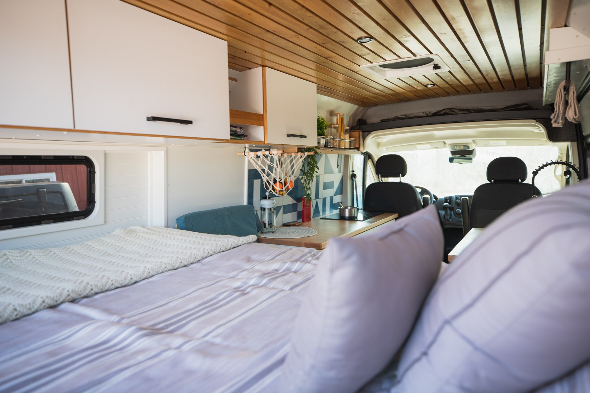 Experience van life in this stylish RV rental. Features a comfy bed, functional kitchen, and bright interior.. Dodge Ram ProMaster 2021