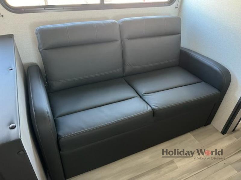This dark grey two-seater sofa offers comfortable seating in your RV rental. Modern design, ideal for small spaces.. Springdale 261BHC 2024