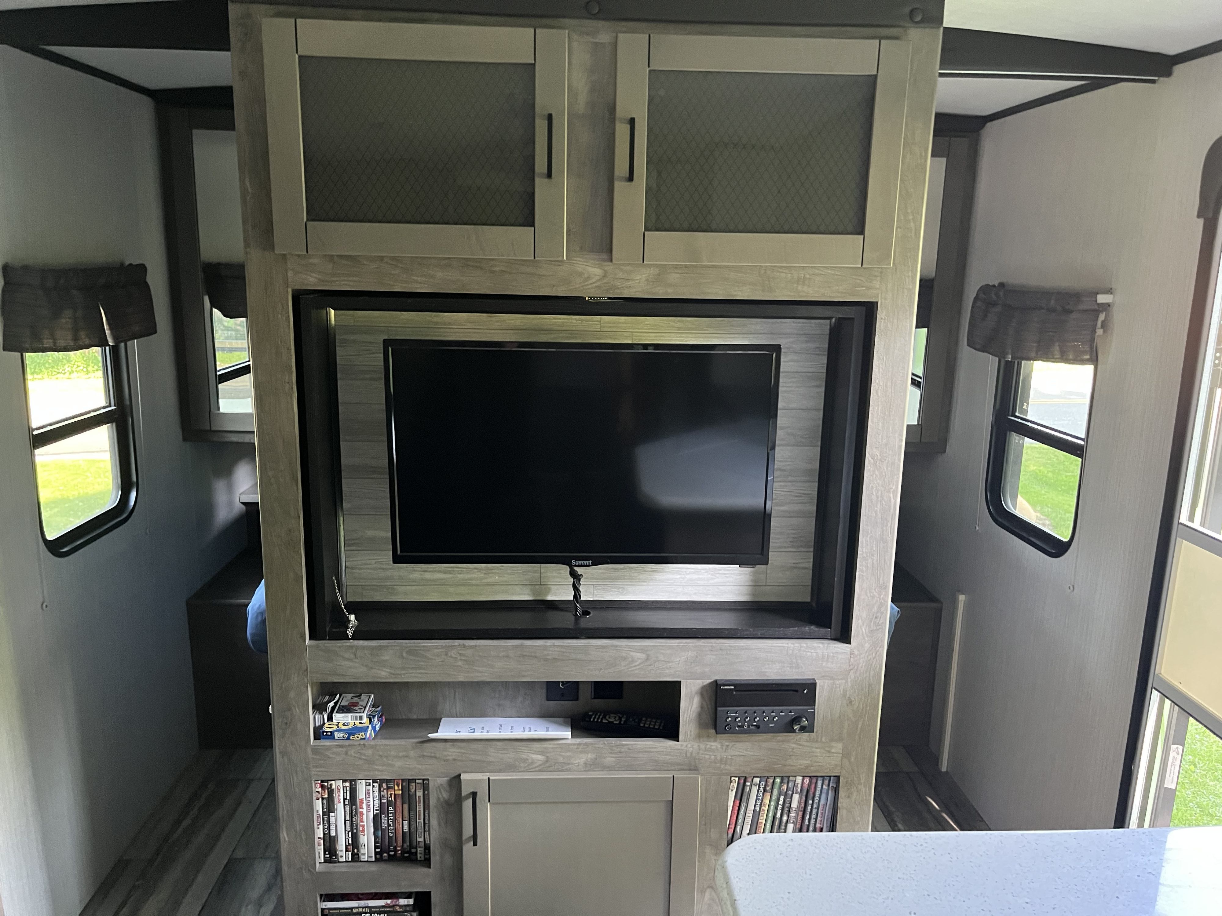 This RV rental offers a well-equipped entertainment center with a TV, overhead storage, and stereo for your travels.. Heartland RVs North Trail 2020