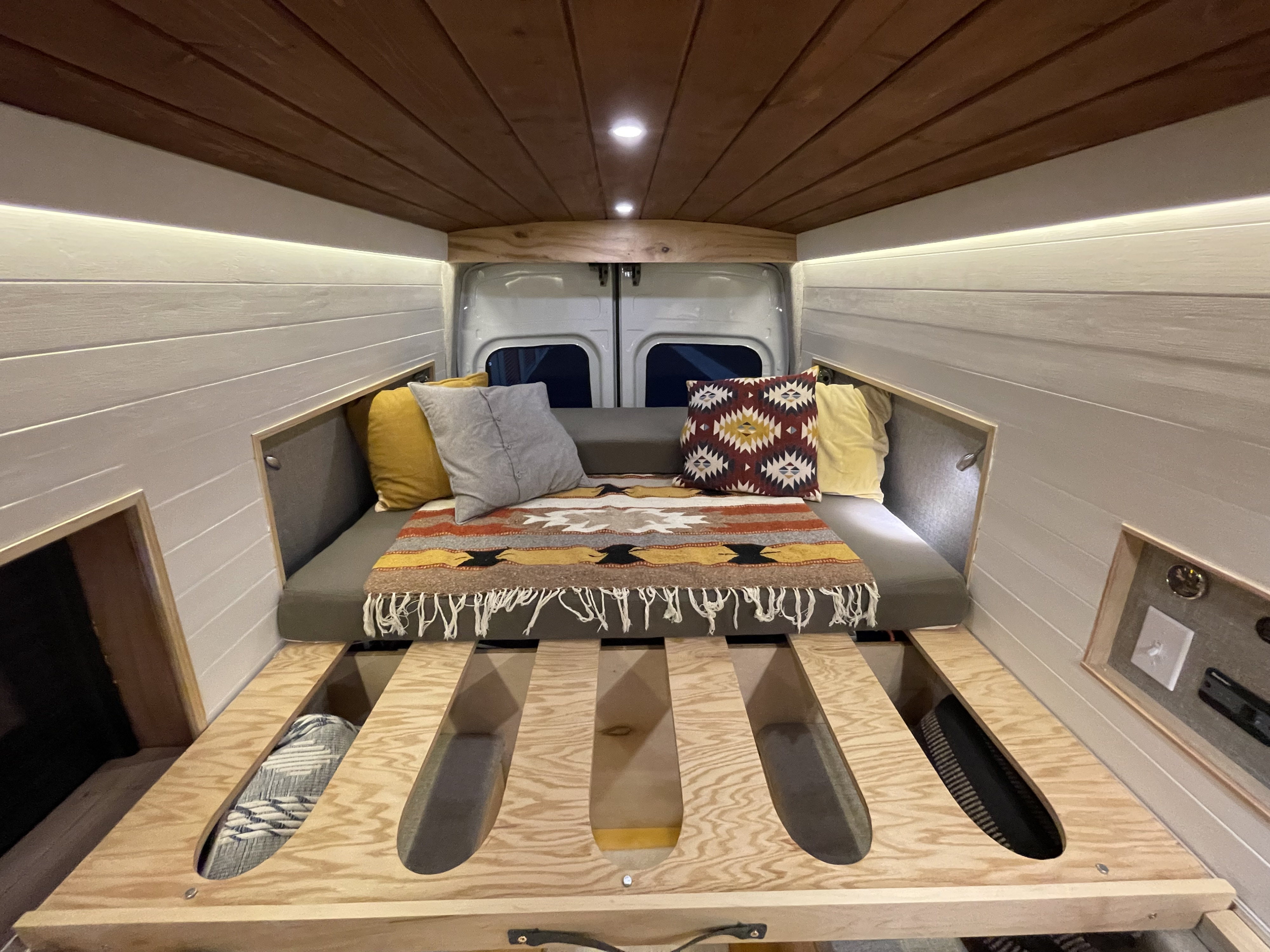 Bed when extended to queen sized + sleep area. Ford Transit 2017