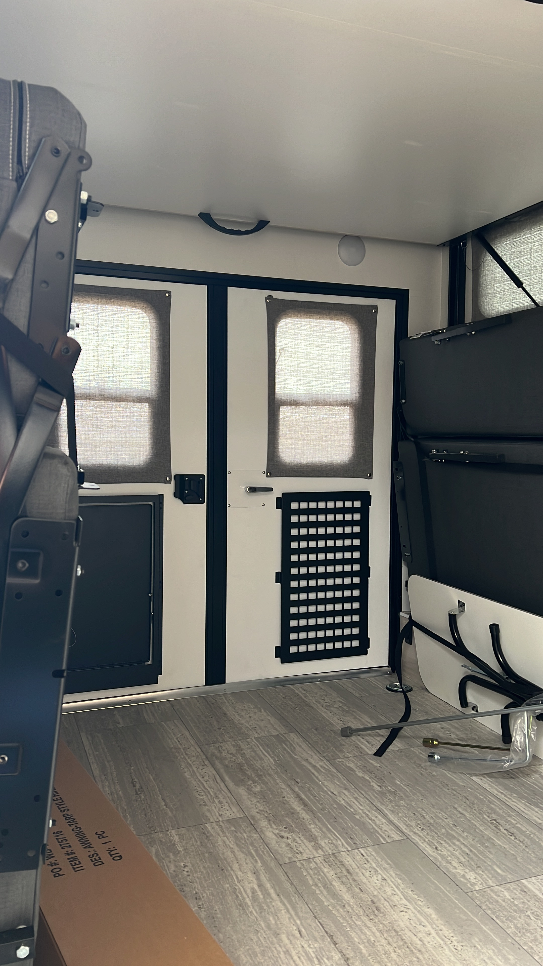 RV rental interior: versatile space with fold-down beds, rear windows, and adaptable cargo storage. Ready for adventure.. Winnebago Hike 100 2023