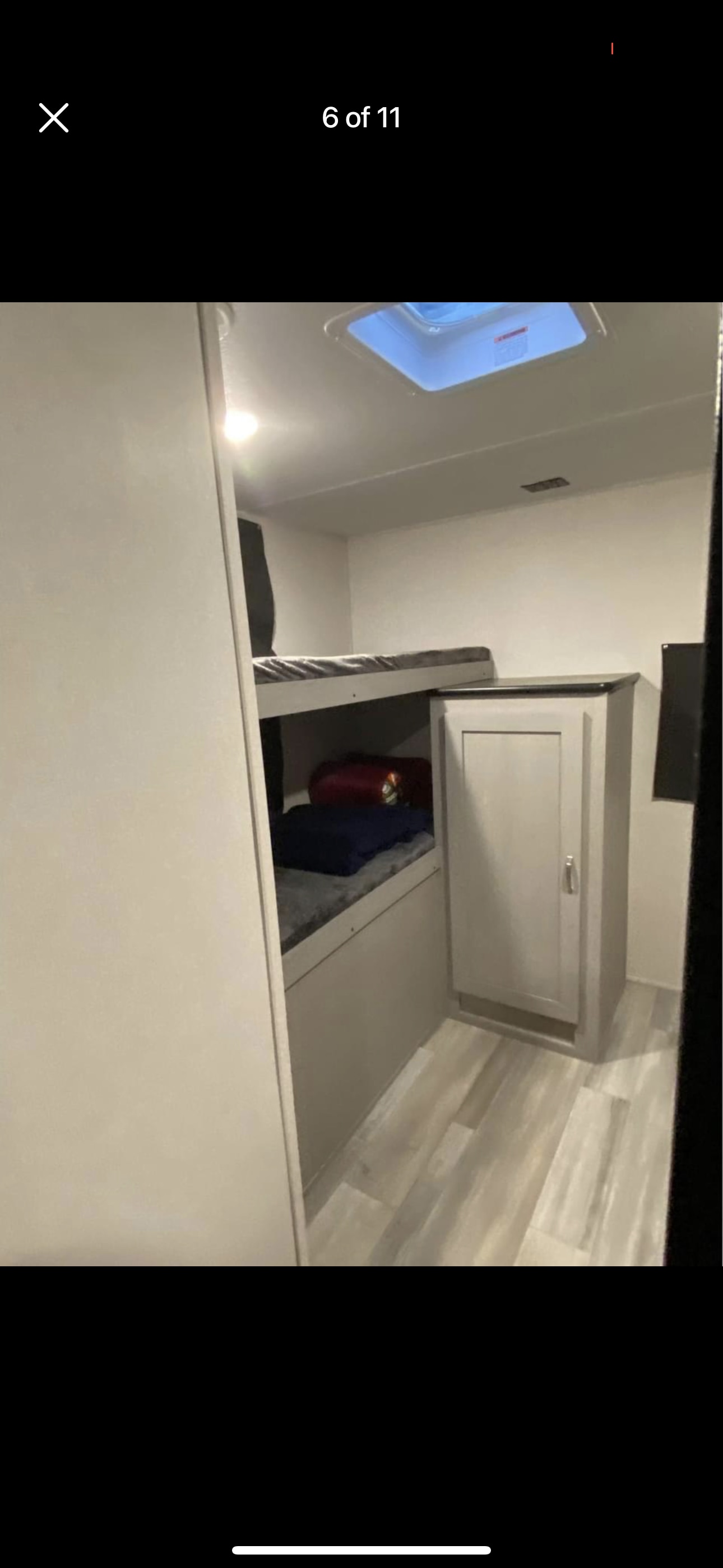 RV rental interior: modern bunk beds provide comfortable sleeping & storage in this spacious recreational vehicle.. Forest River 31bhd 2023