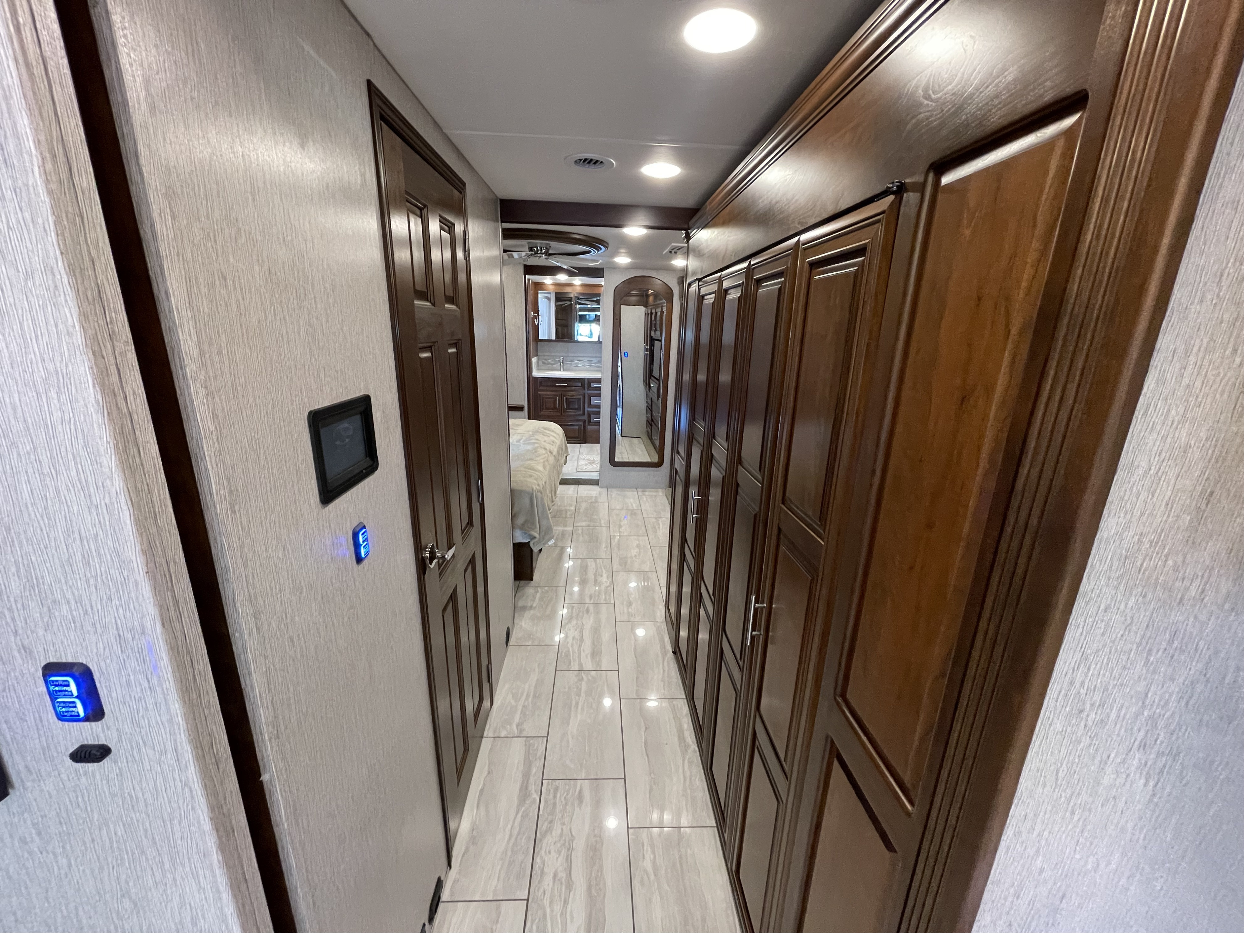 Explore the spacious interior of this modern RV rental! Hallway leads to bedroom & bathroom with ample storage.. Berkshire XLT 2021