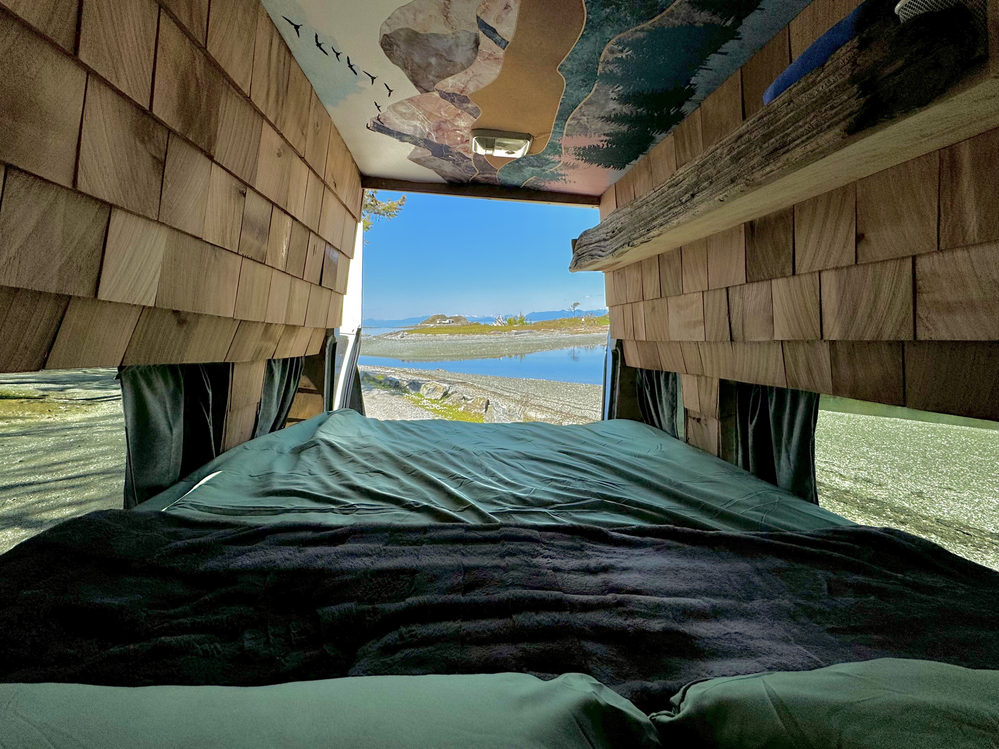 Wake up to stunning views in this unique rv rental! Cozy bed, shiplap walls, and a nature mural lead to a bay vista.. Ford Econoline E250supercab 2001