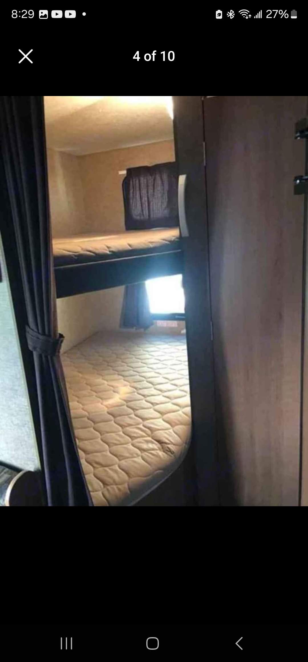 Compact RV rental interior featuring convenient bunk beds with mattresses for extra sleeping space, ideal for travel.. StarCraft autumn ridge 2014