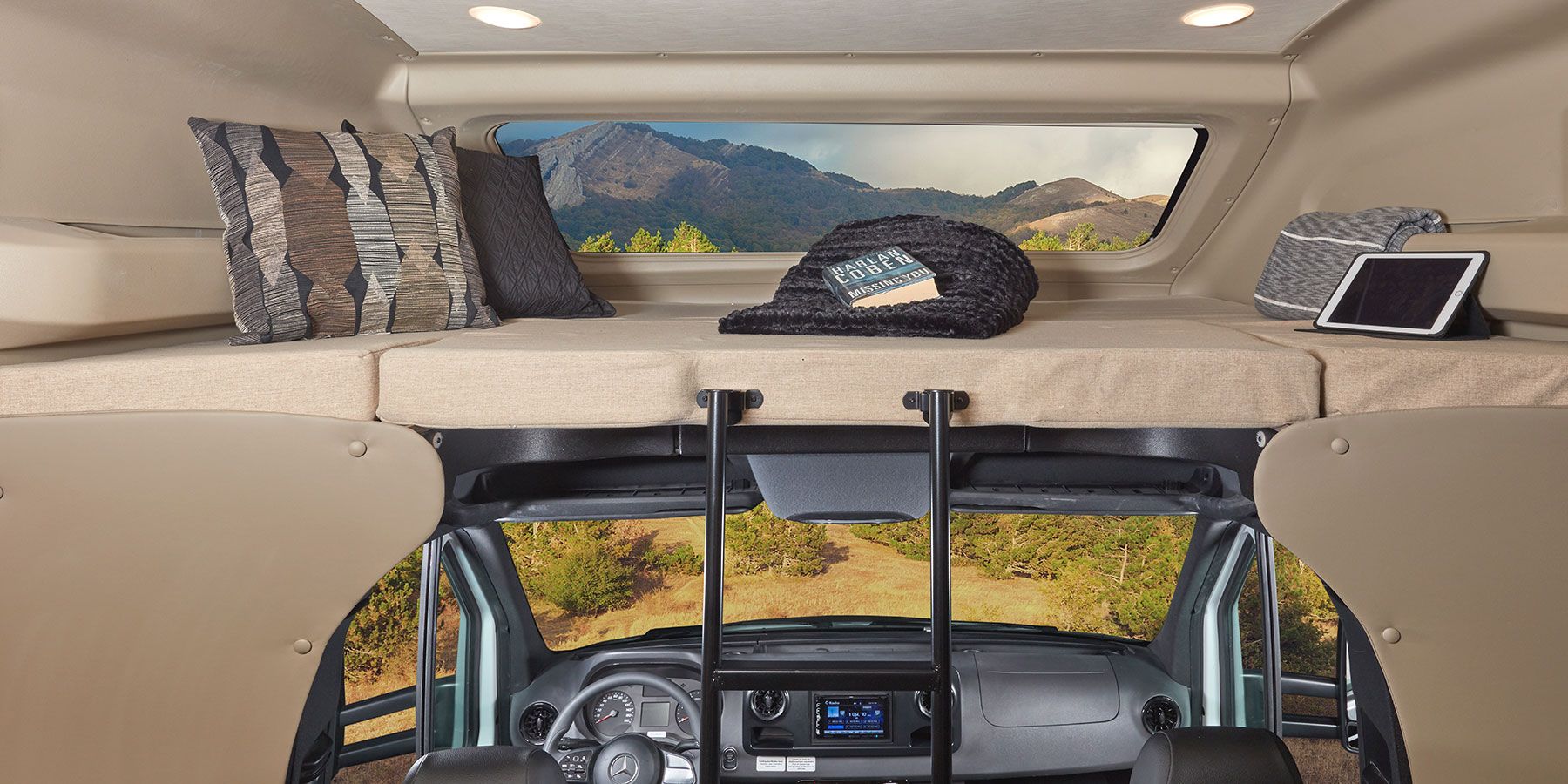 Bunk above driver cabin with panoramic window and push-button roller shade.. Jayco Melbourne 2020