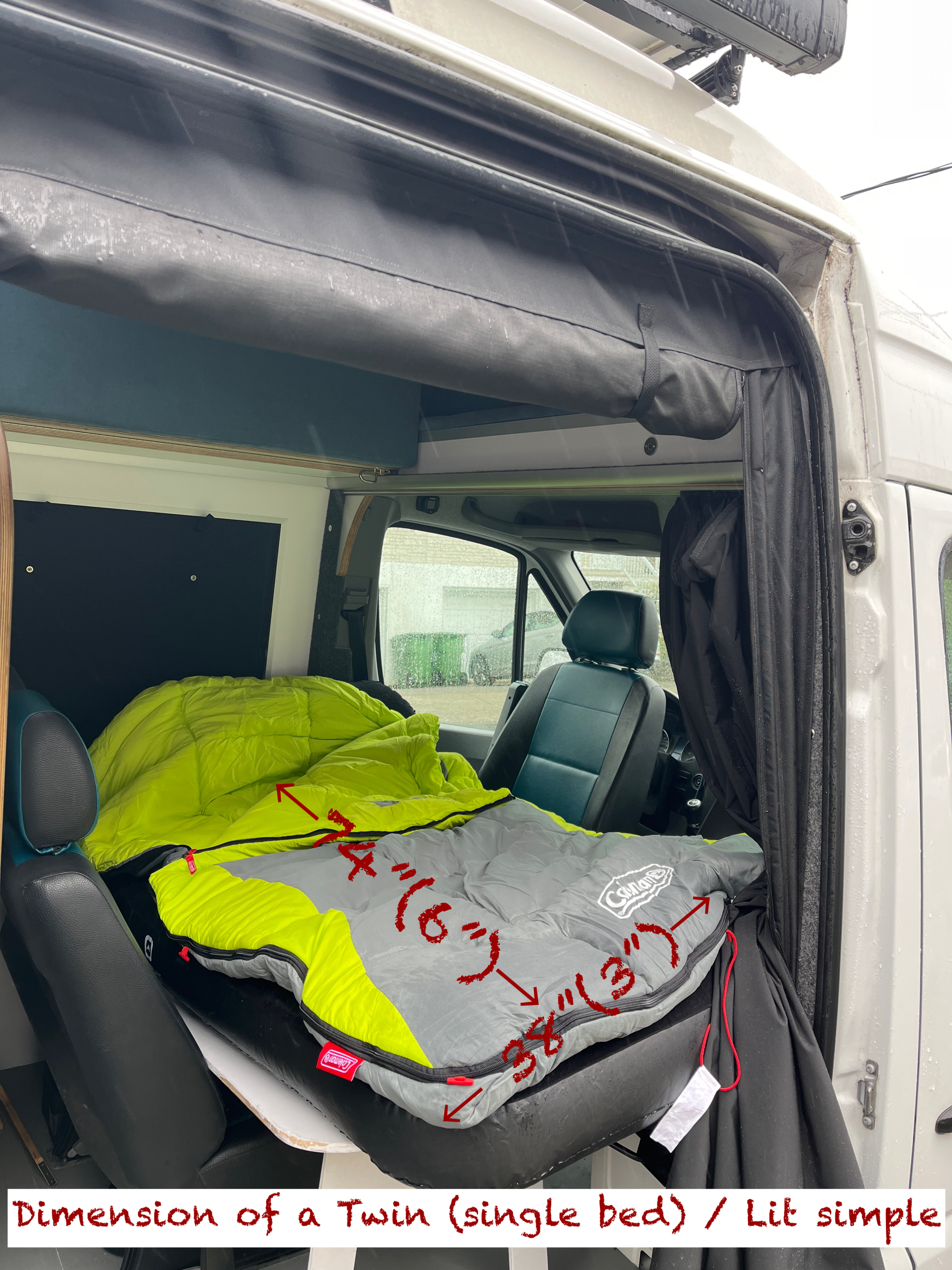 Inside an RV rental: a compact twin-sized bed setup (74"x38") with a sleeping bag, perfect for van life adventures.. Mercedes Sprinter 2015