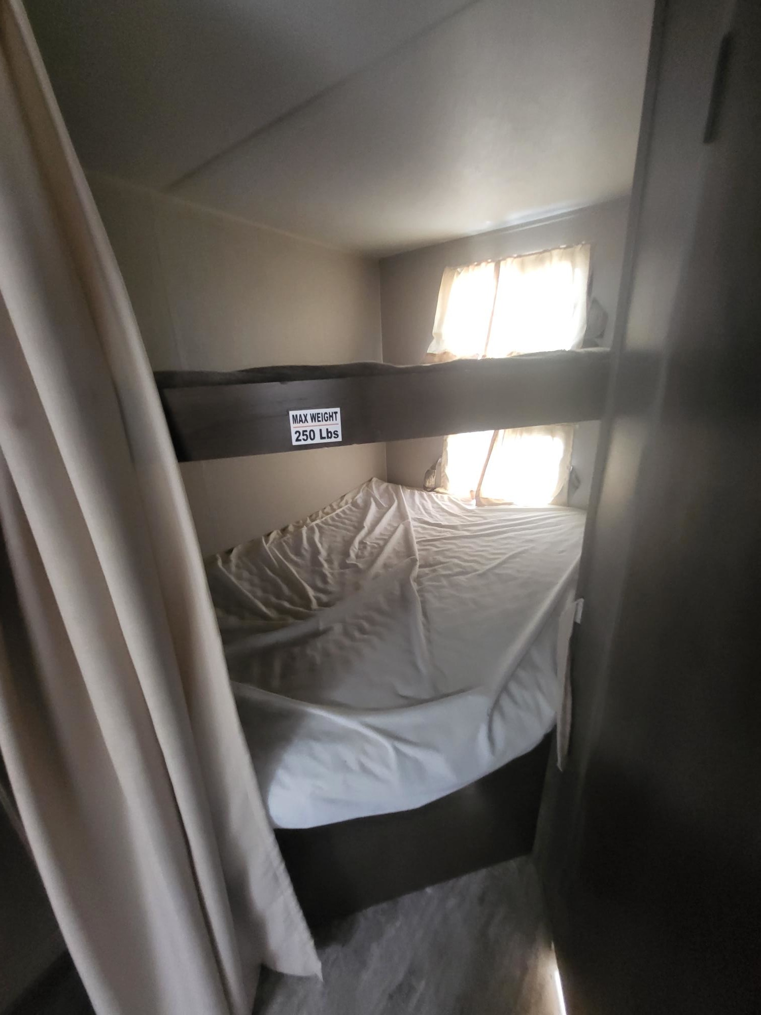 Cozy RV rental bunk beds with a 250lb max weight for comfortable sleeping. Features windows & privacy curtain.. K-Z CONNECT 281BHK 2019