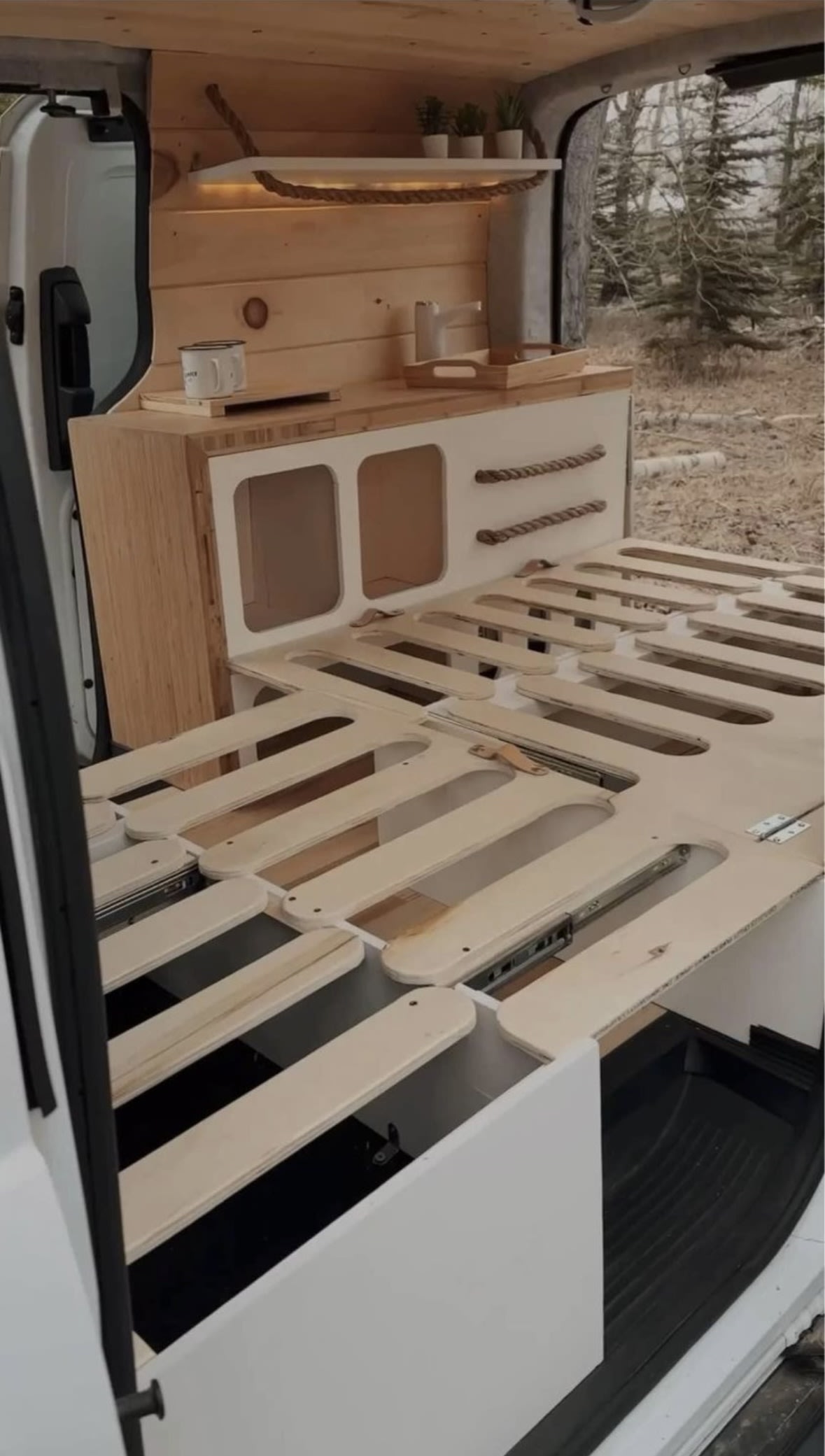 Pull out bed that fits 2 people, and was built so someone 6' 5" tall can sleep comfortably.
Custom CNC made.. Ford Transit 2015