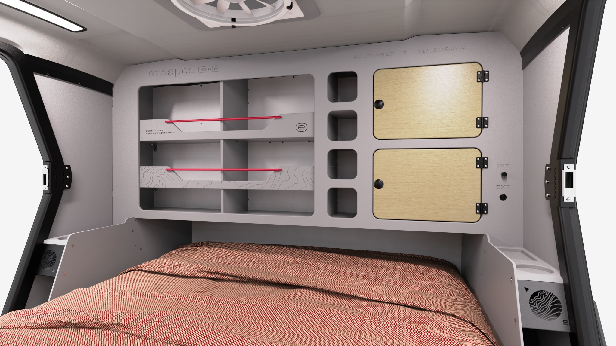 Escapod RV rental interior: a comfy bed under modular storage with shelves, red bars, and wood cabinets. Ready for adventure.. Escapod Topo 2 - Nomad 2024