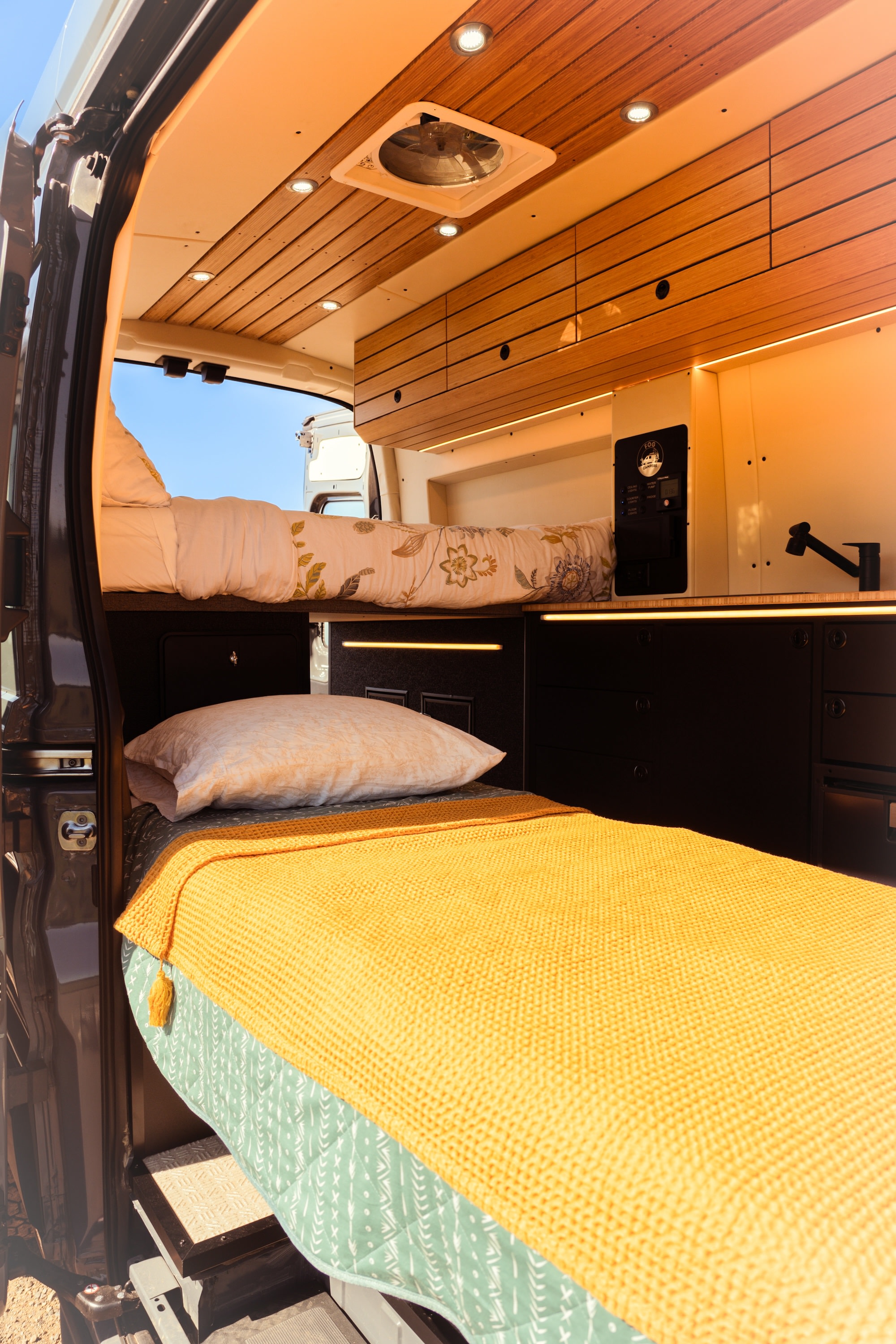 Step into this cozy rv rental with bunk beds, warm wood interior, and functional amenities. Perfect for road trips!. Ford Transit 2023