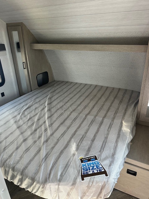 Spacious RV rental bedroom with custom king bed (66"x78"). Perfect for comfortable travel.. Salem Cruise Lite 273QBXL 2023