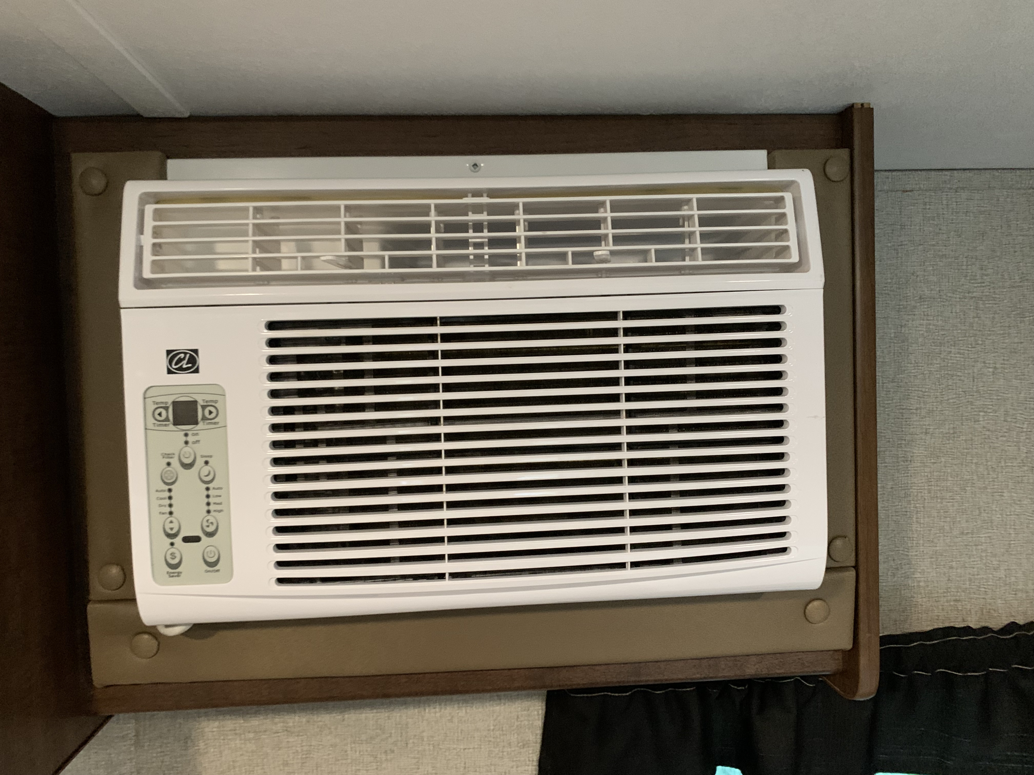 White air conditioning unit mounted in an RV interior, essential for climate control during your RV rental adventure.. Keystone RV Hideout LHS Mini 2017