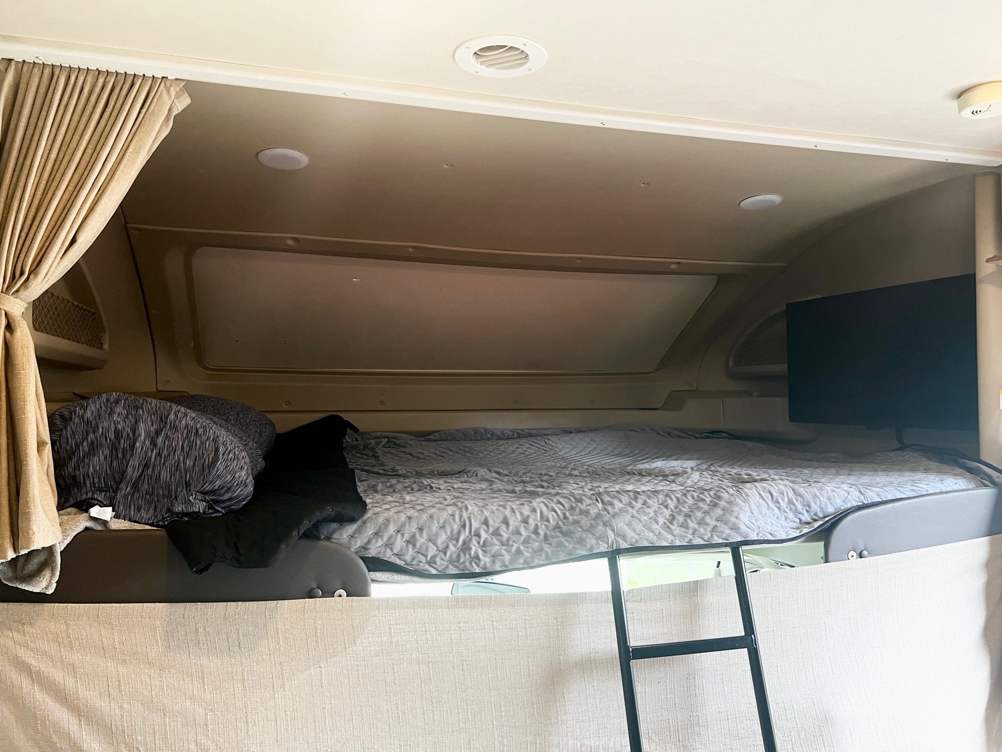 This is a queen size bunk over the cab. Sleeps 2. The tv is located in this bunk and swivels out for everyone to watch. . Entegra Coach Odyssey 2020