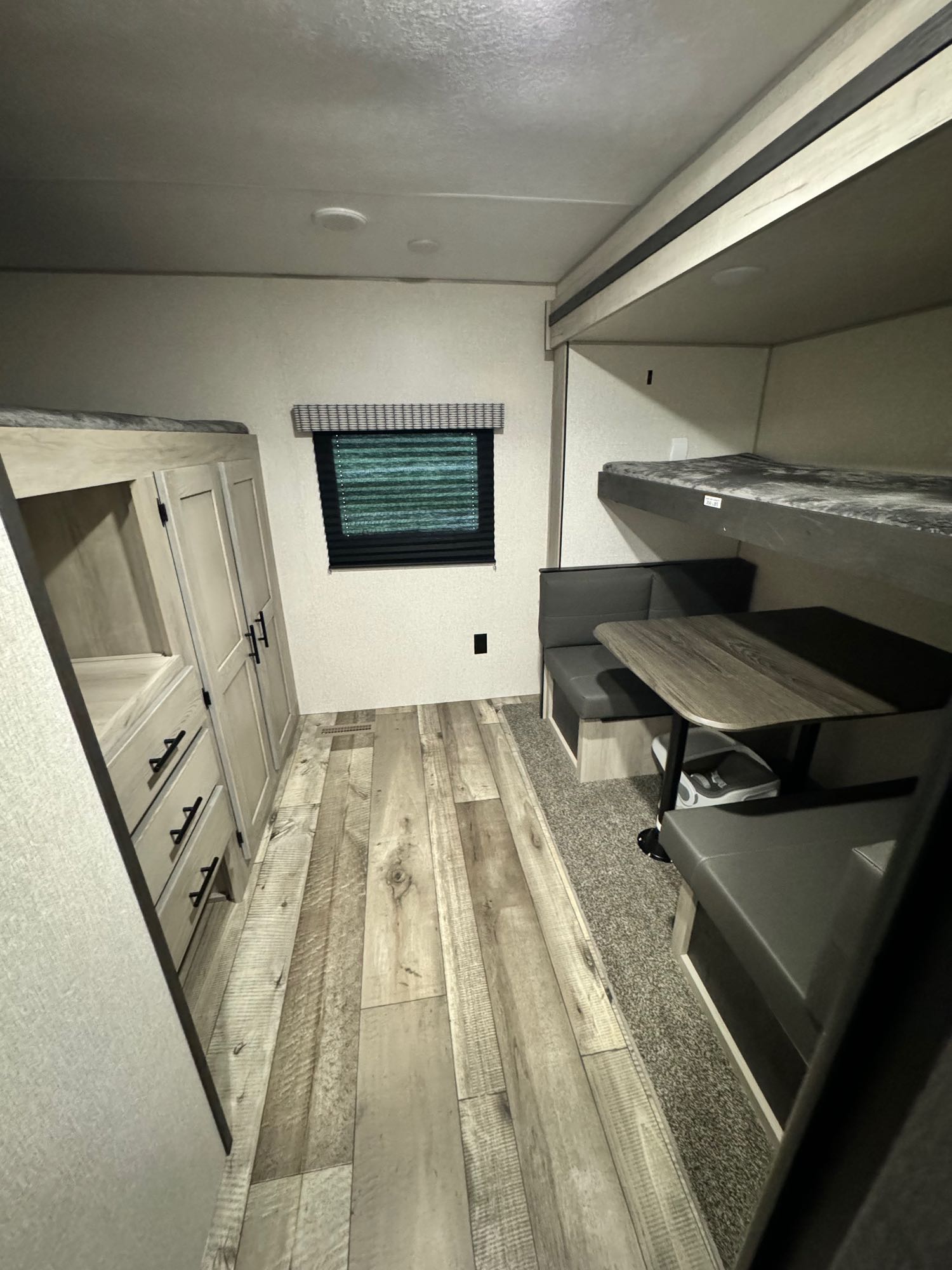 Cozy RV rental interior with bunk beds, a dinette, and ample storage, perfect for family adventures.. Connect SE 2022