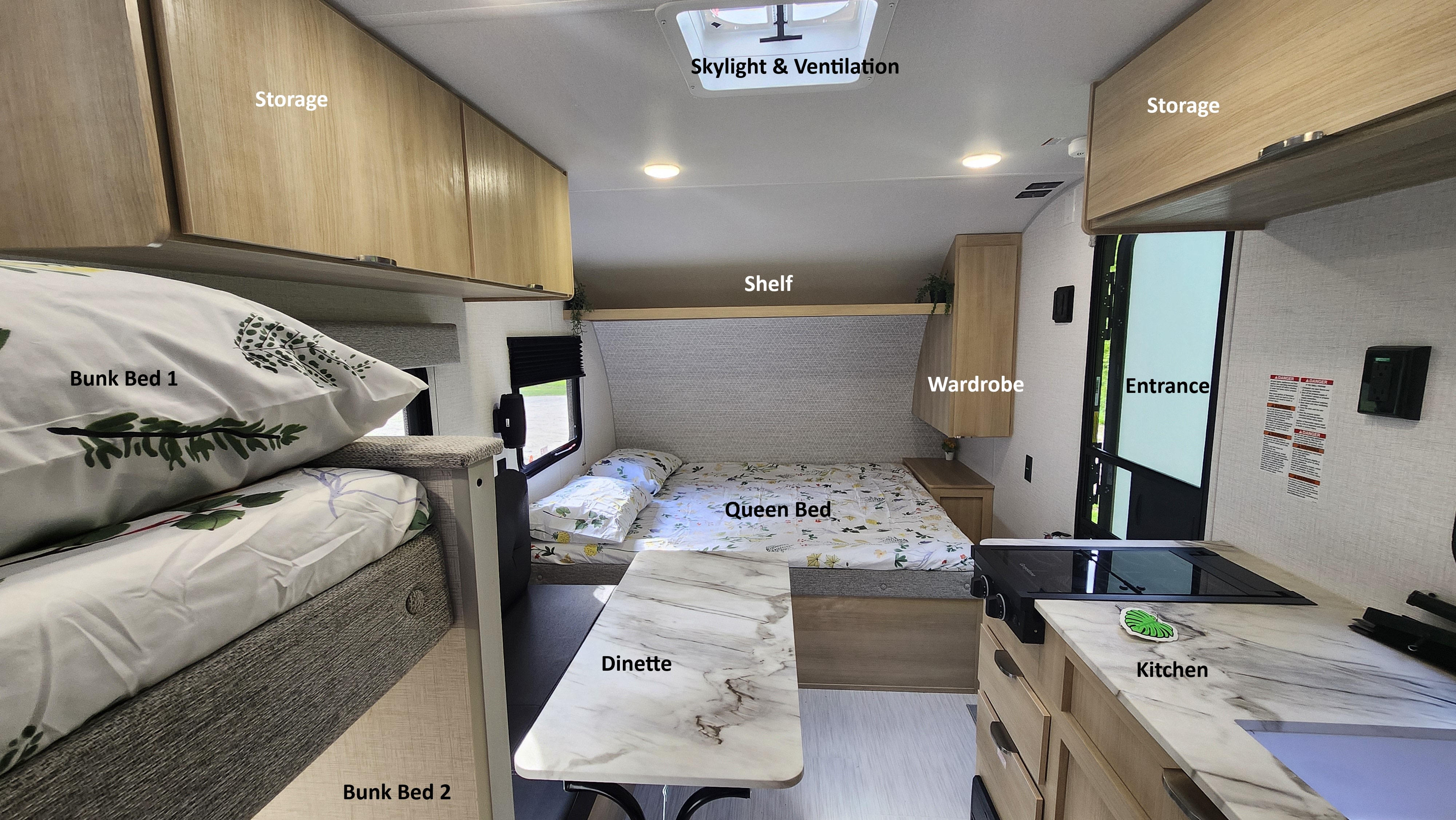 Cozy RV rental interior: bunk beds, queen bed, dinette, kitchen, and overhead storage provide comfort for travel.. Forest River Salem FSX 174BHLE 2024