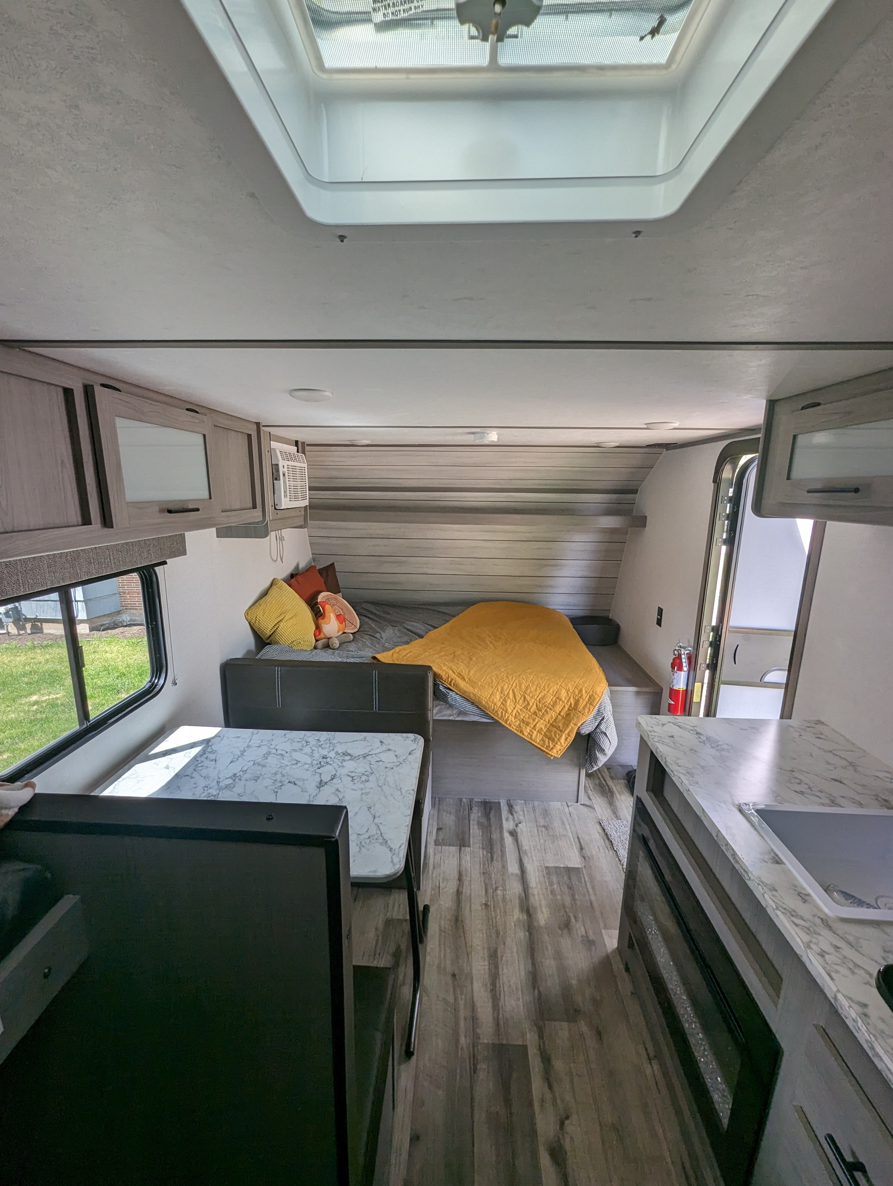 RV rental: Bright interior featuring a dinette, bedroom, kitchen, and skylight. Ready for adventure.. Dutchmen Coleman Lantern 17B 2024