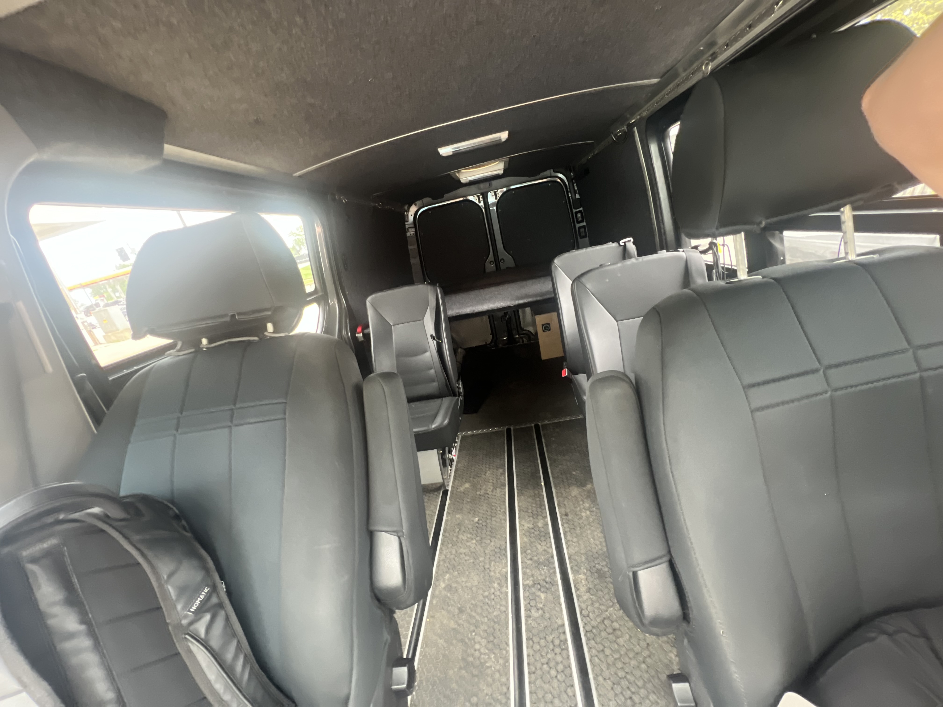 Step inside this RV rental: versatile seating, a raised bed, and floor tracks for your next adventure.. Mercedes-Benz Sprinter 2016