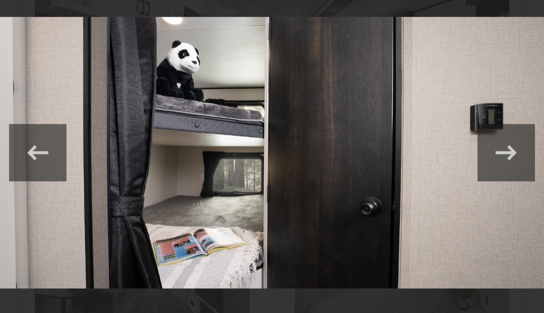 Experience an RV rental! Compact interior featuring bunk beds, a forest view window, and a Dometic thermostat.. Highland Ridge RV Open Range 2024