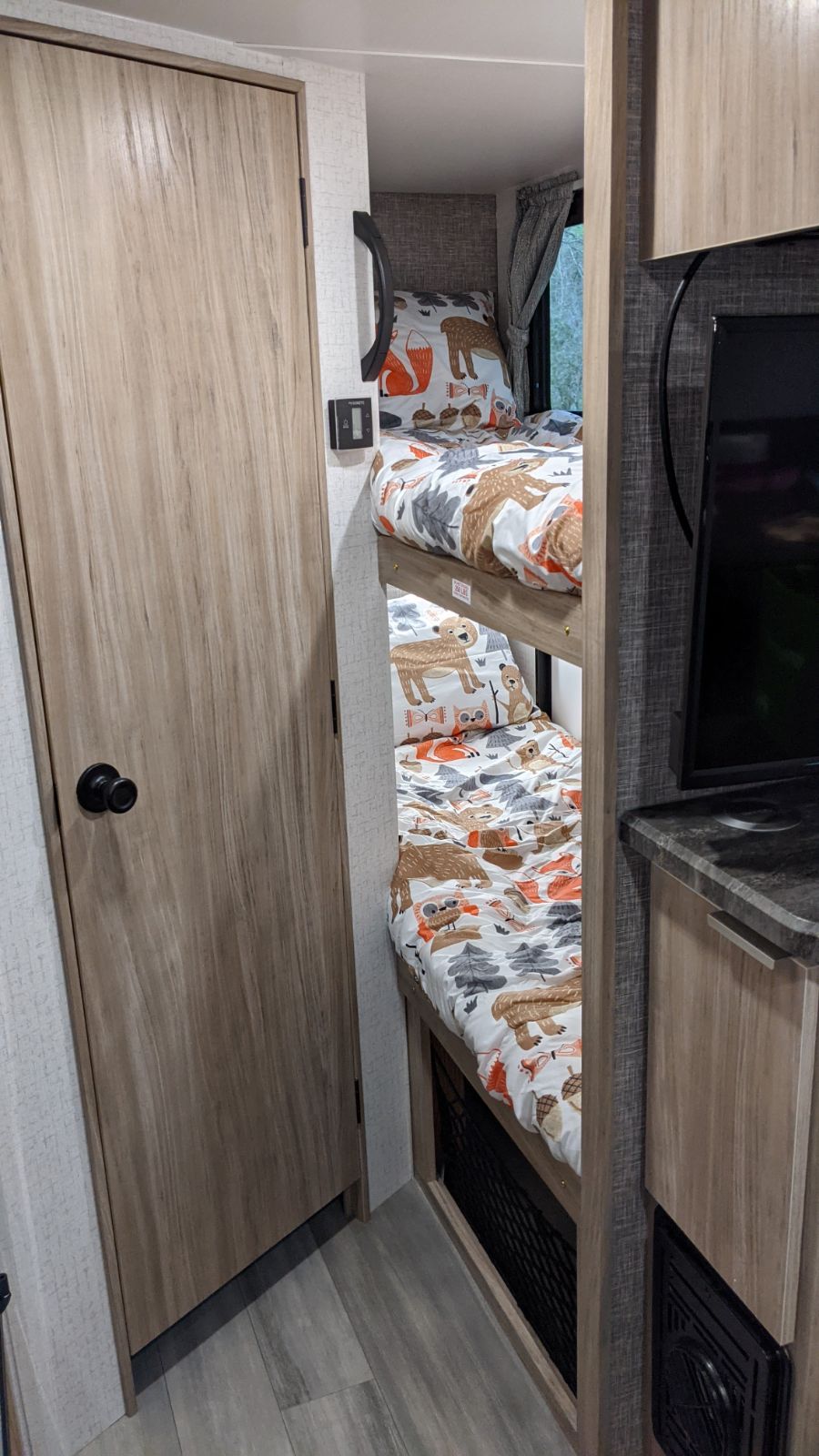 Cozy RV rental: bunk beds with playful woodland animal bedding, ideal for family camping trips.. Winnebago Other 2021