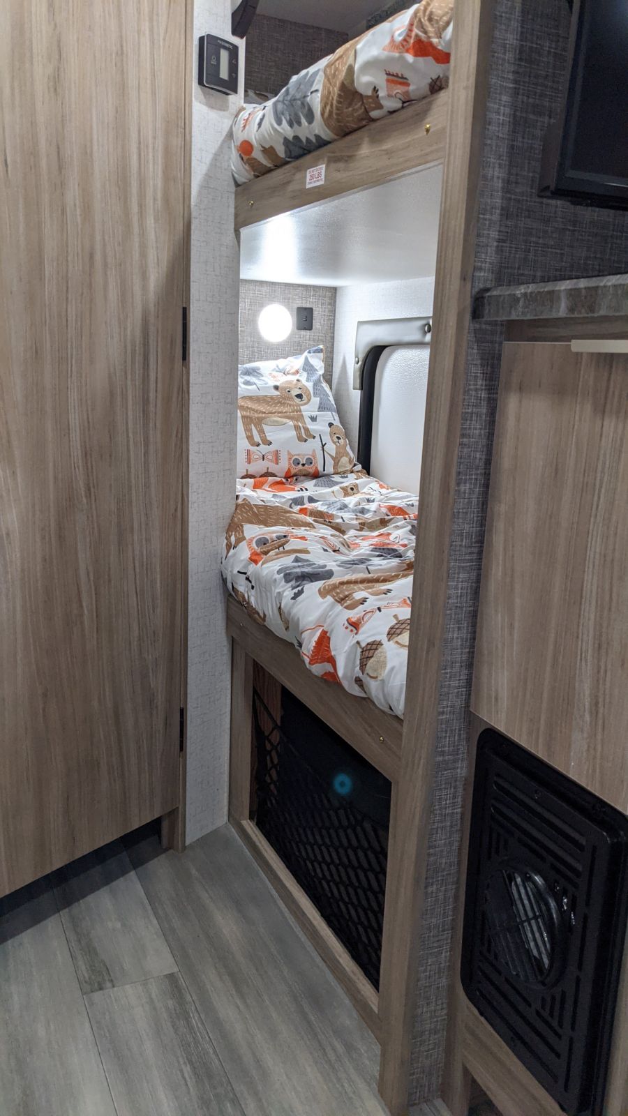 Cozy RV rental bunk beds with charming animal-themed bedding, ideal for family trips in a camper.. Winnebago Other 2021