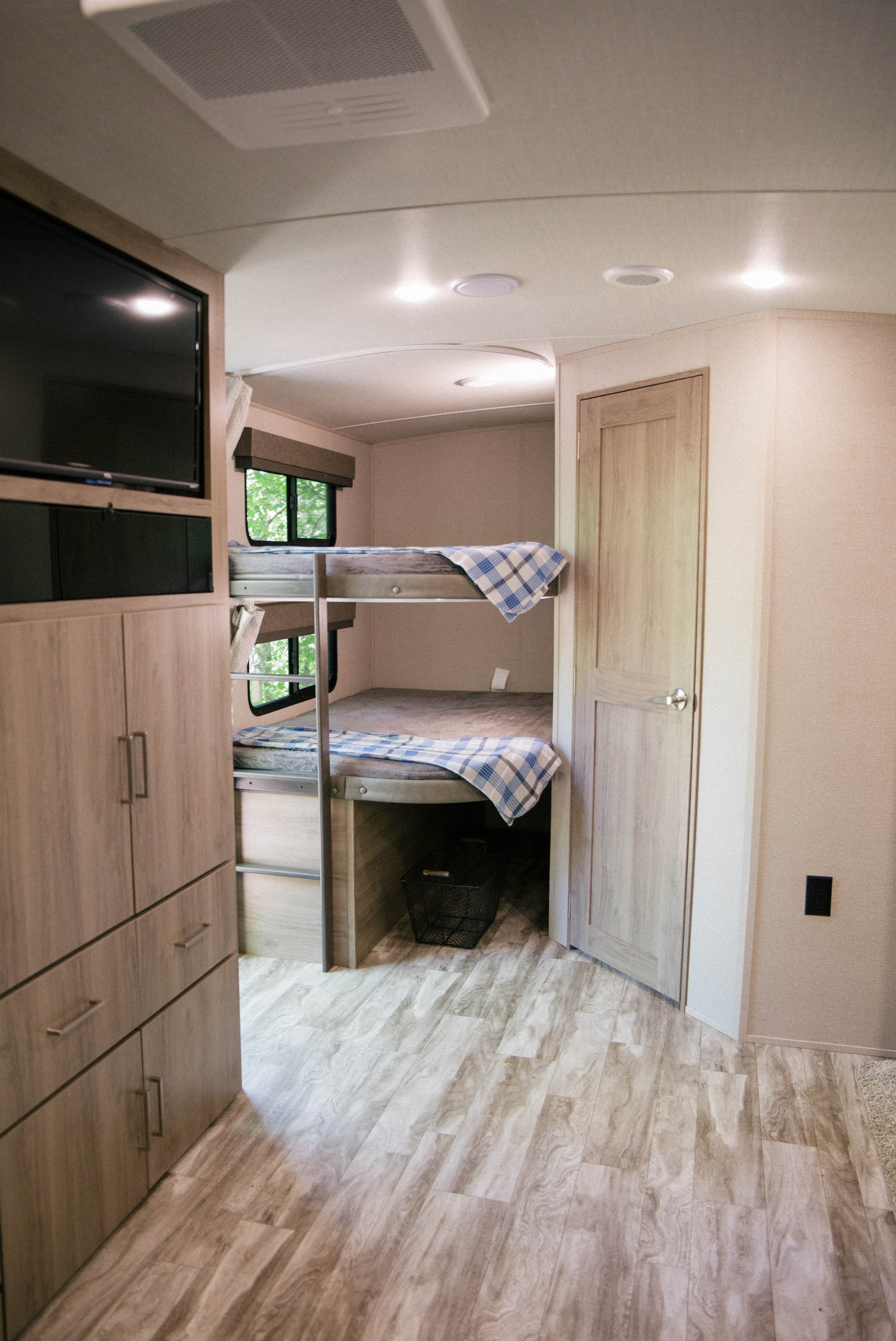Step inside this cozy RV rental! Features include built-in bunk beds, TV, and ample storage, ready for your next adventure.. Grand Design Imagine 2023