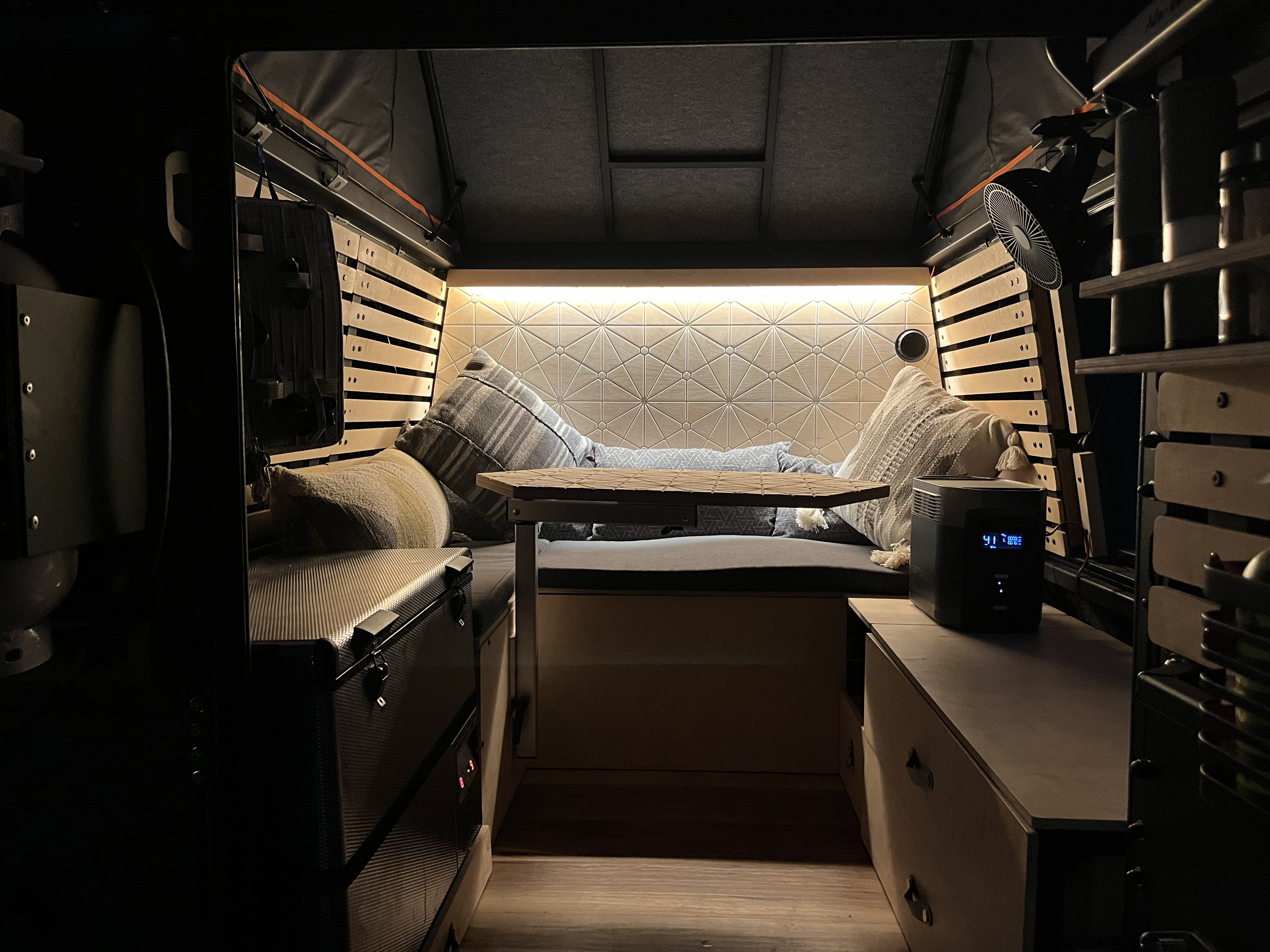 Cozy RV rental interior with comfy seating, ambient lighting, and storage. Perfect for travel!. Airstream Overlander 2019