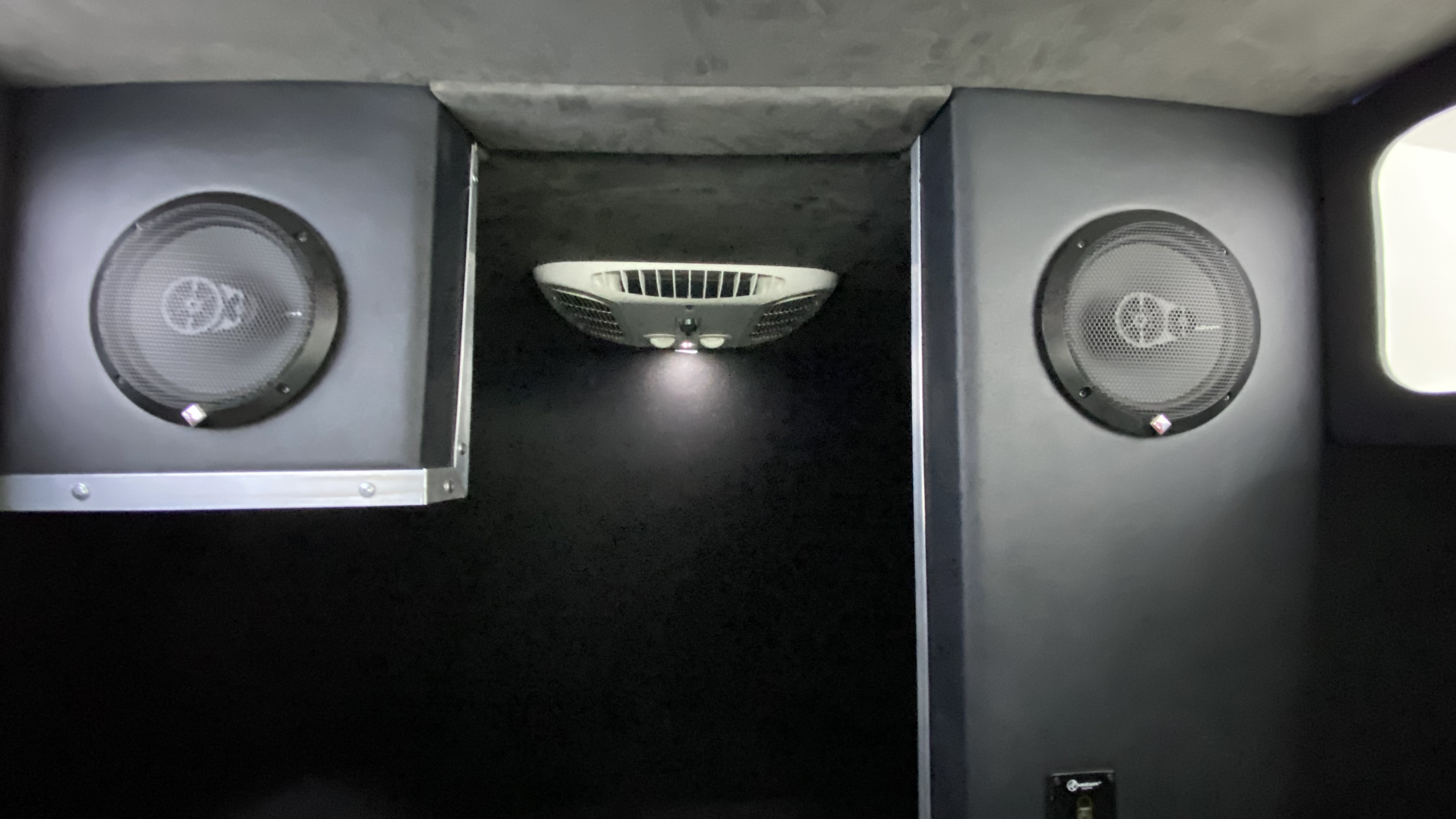 RV rental interior featuring dual Rockford Fosgate speakers, central overhead light, and AC vent for comfort.. Mercedes-Benz Sprinter 2014