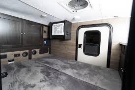 RV rental interior: Spacious floor for sleeping/cargo, wall cabinets, AC unit, and sturdy entry door.. Braxton Creek Bushwhacker 2022