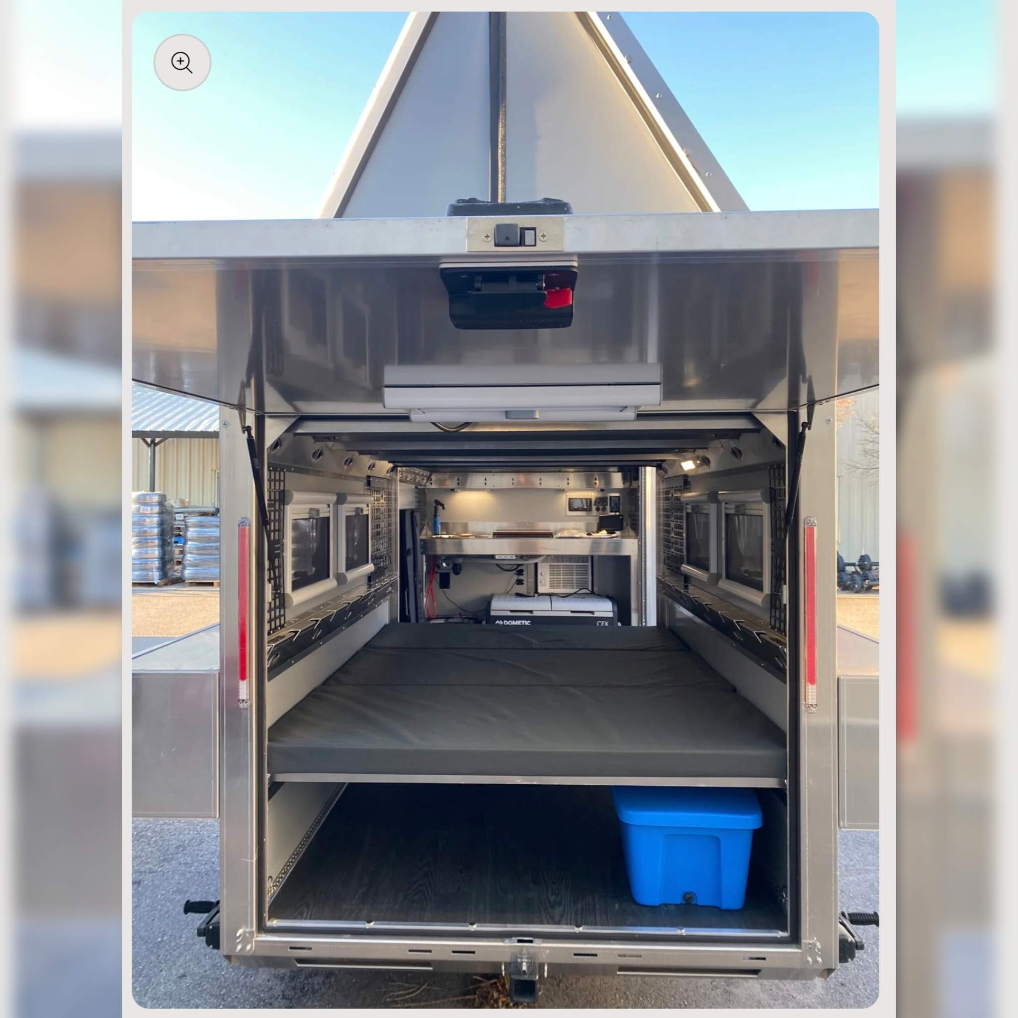 RV rental interior: a compact, versatile camper with a comfortable bed, pull-out storage, and a Dometic fridge/galley for adventure.. Other Other 2023