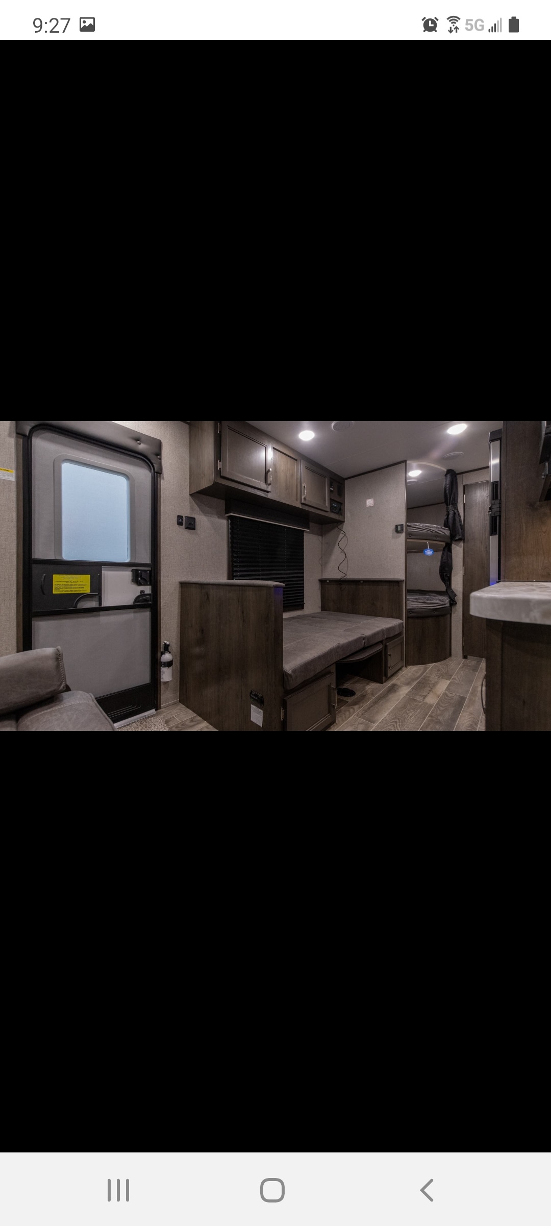 Inside an RV rental travel trailer: Dinette, bunk beds, and overhead cabinets offer cozy, functional living space.. Jayco Jay Flight SLX 2021