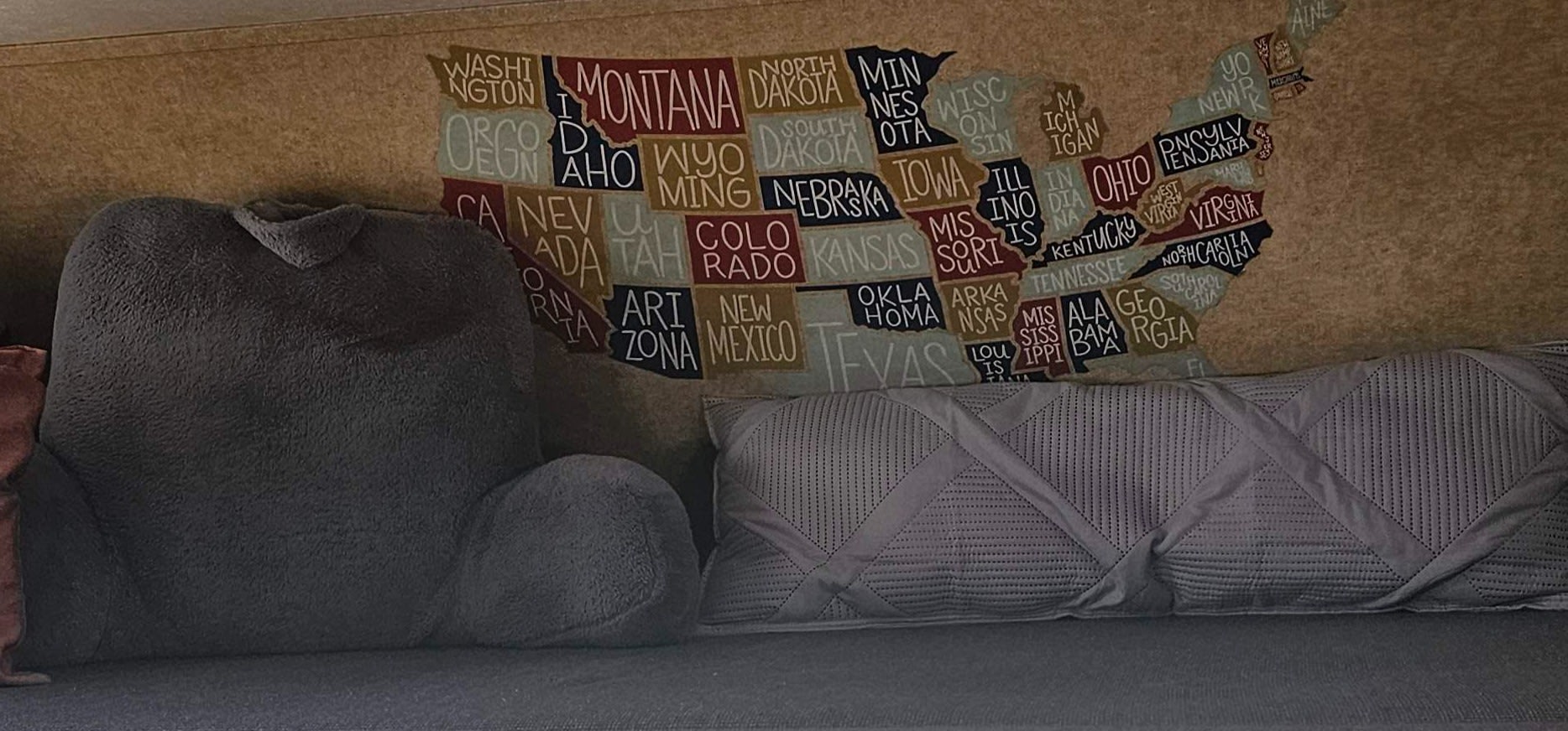 This cozy rv rental interior features a fabric US states map wall hanging and soft pillows, ideal for comfortable travel.. Thor Majestic 2013