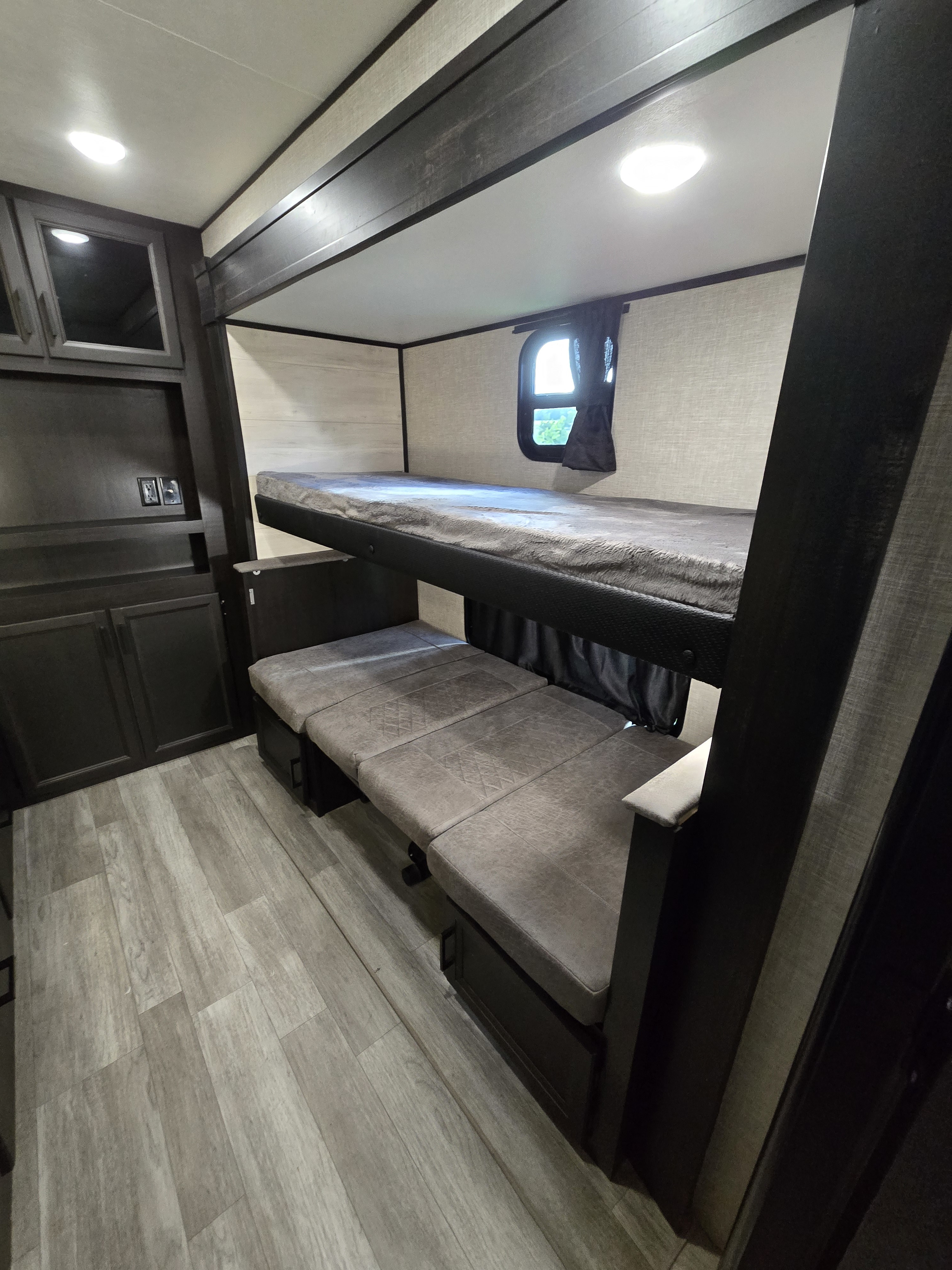 RV rental: Modern bunk beds over a convertible dinette in a compact living space.. Jayco Jay Flight 2022