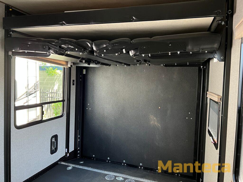 RV rental: See this toy hauler's versatile garage with stowed power bunk bed for maximum cargo space.. Dutchmen Endurance 3706 2018
