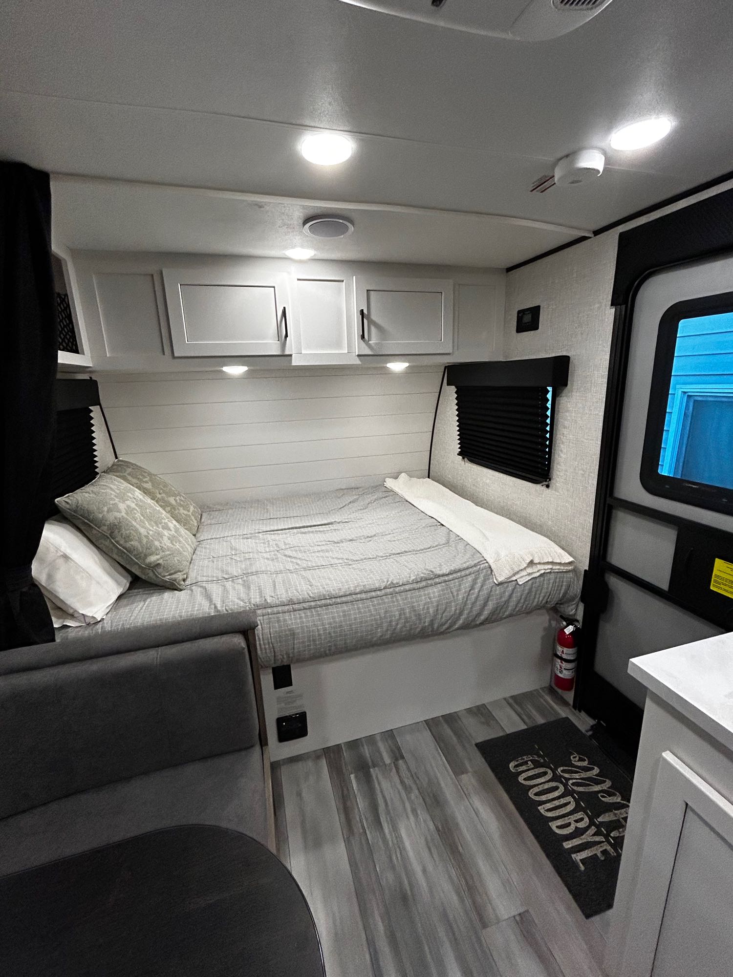 Modern RV rental interior with bed, dinette, and bright lighting.. Jayco Jay Flight SLX Baja Edition 2024