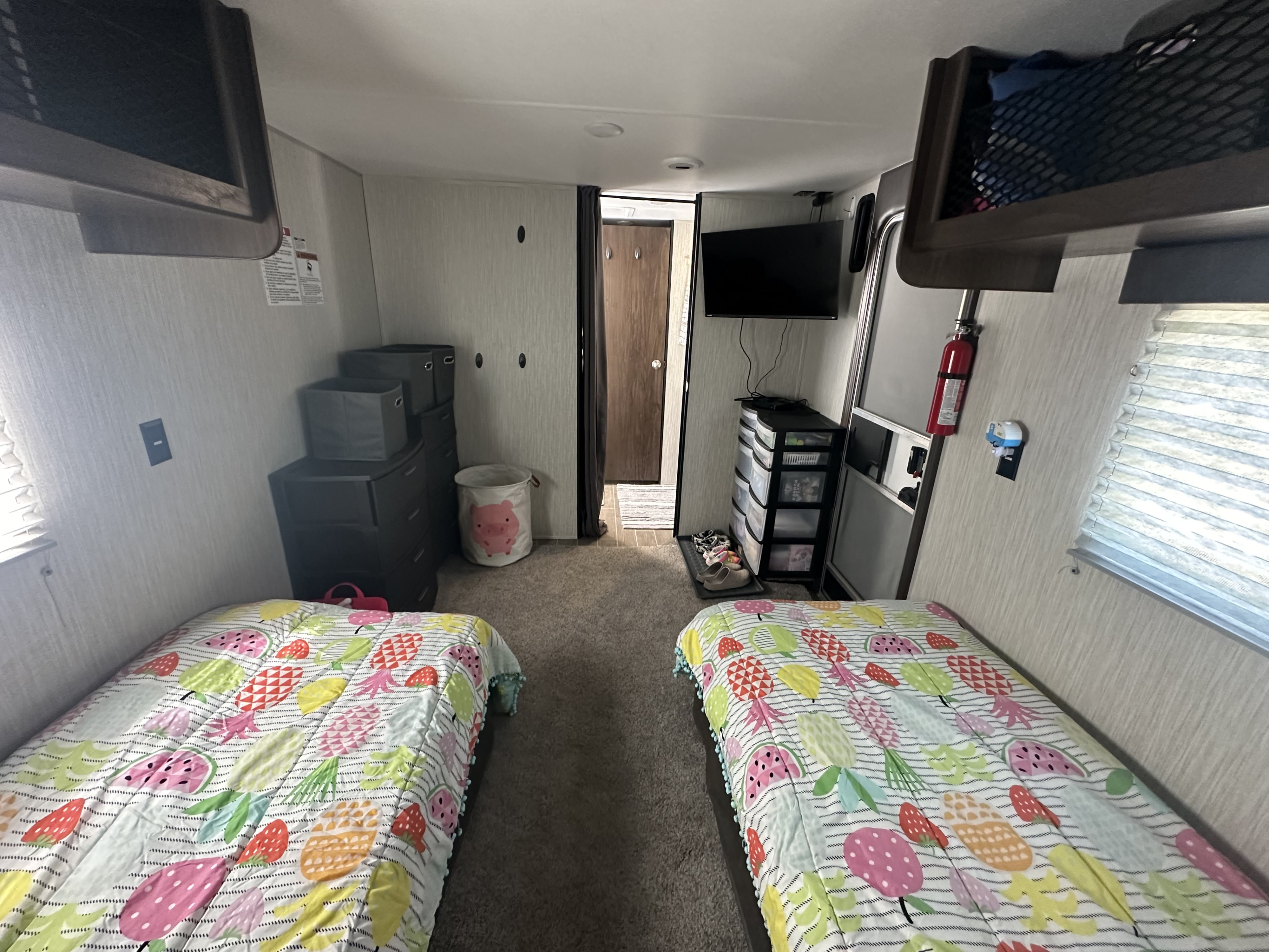 RV rental bunk room featuring bright beds, clever storage solutions, and entertainment. Great for kids and families.. Forest River Cherokee Grey Wolf 2020